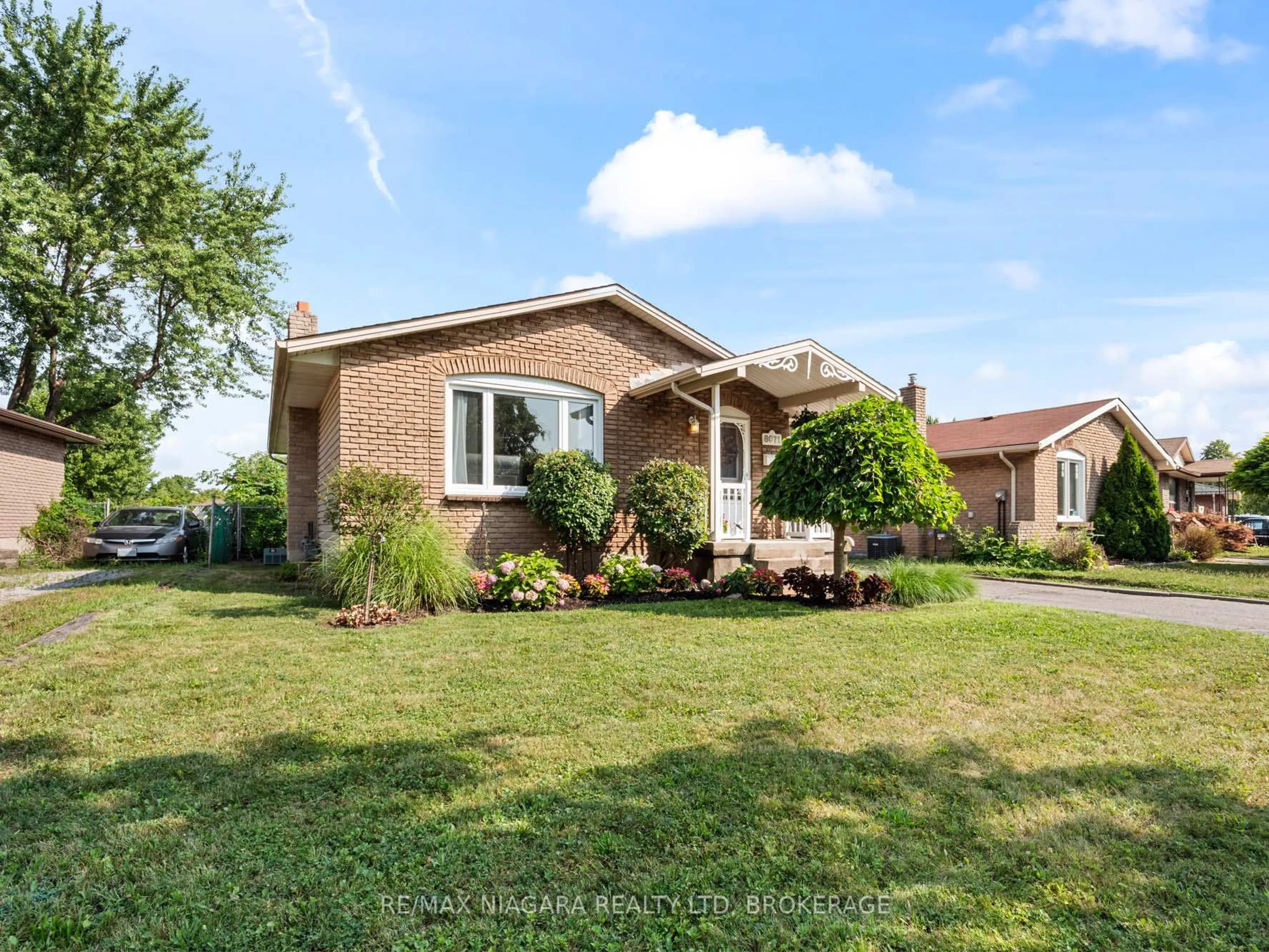 Home with brick exterior material, street for 8071 Paddock Trail Dr, Niagara Falls Ontario L2H 1W8