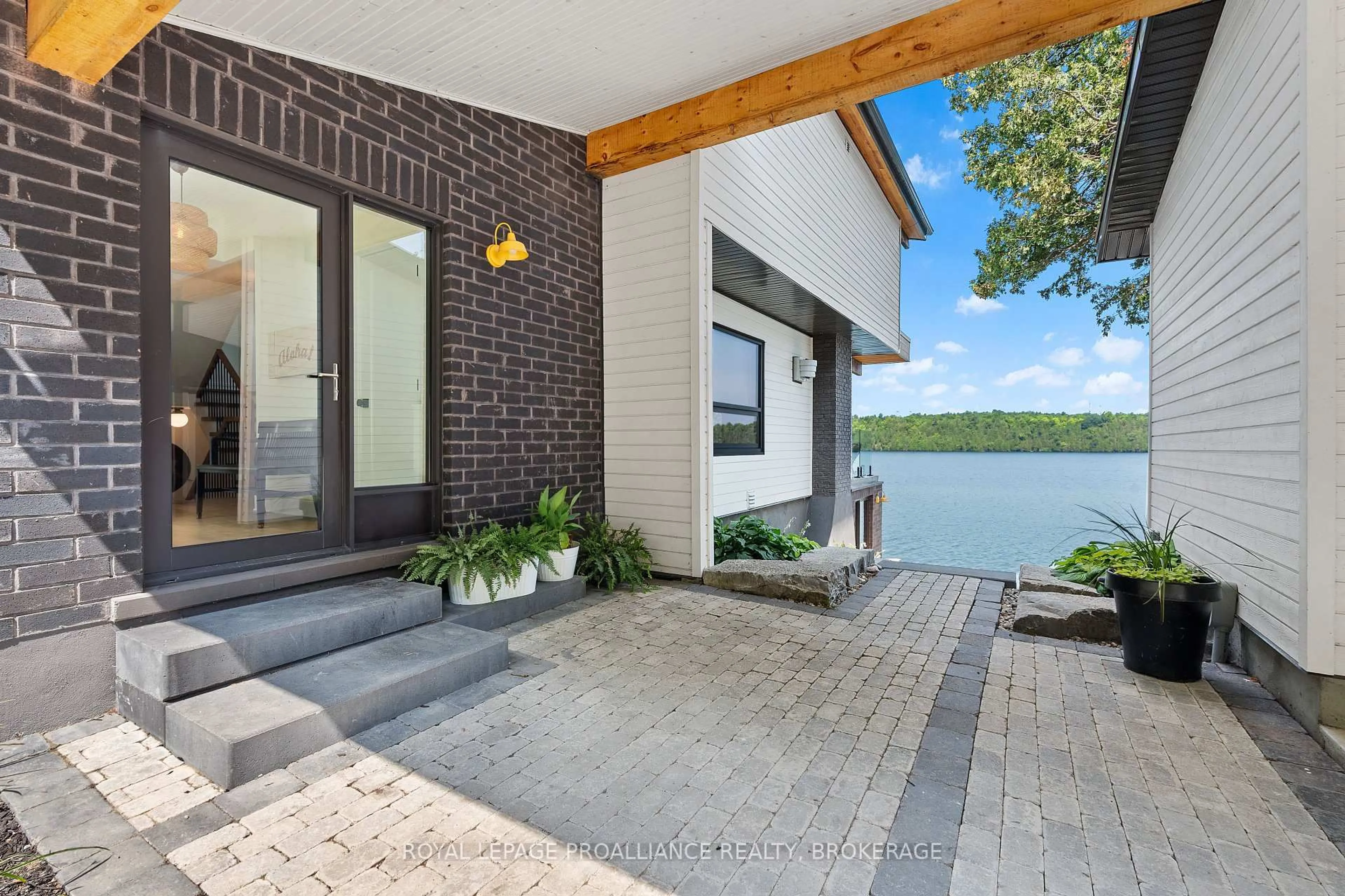Home with brick exterior material, water/lake/river/ocean view for 1111 Heron Lane, Inverary Ontario K0H 1X0