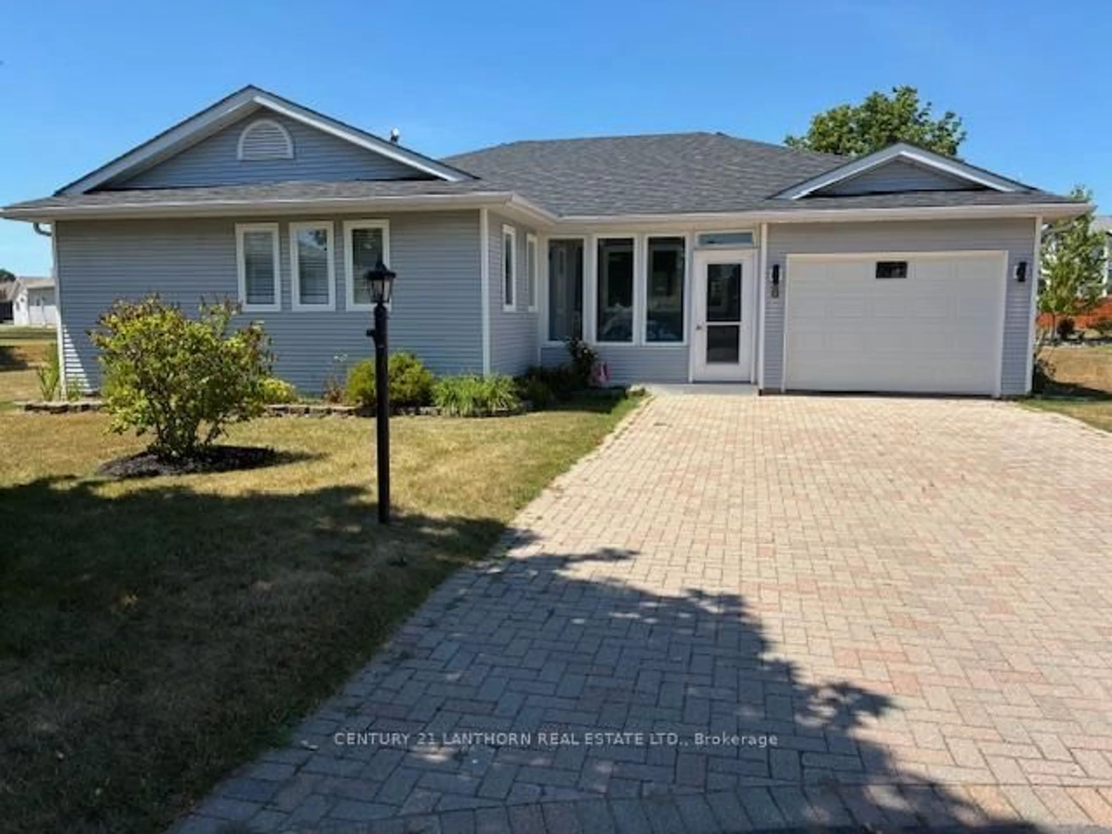 Home with vinyl exterior material, street for 8 Quaker Crt, Prince Edward County Ontario K0K 3L0