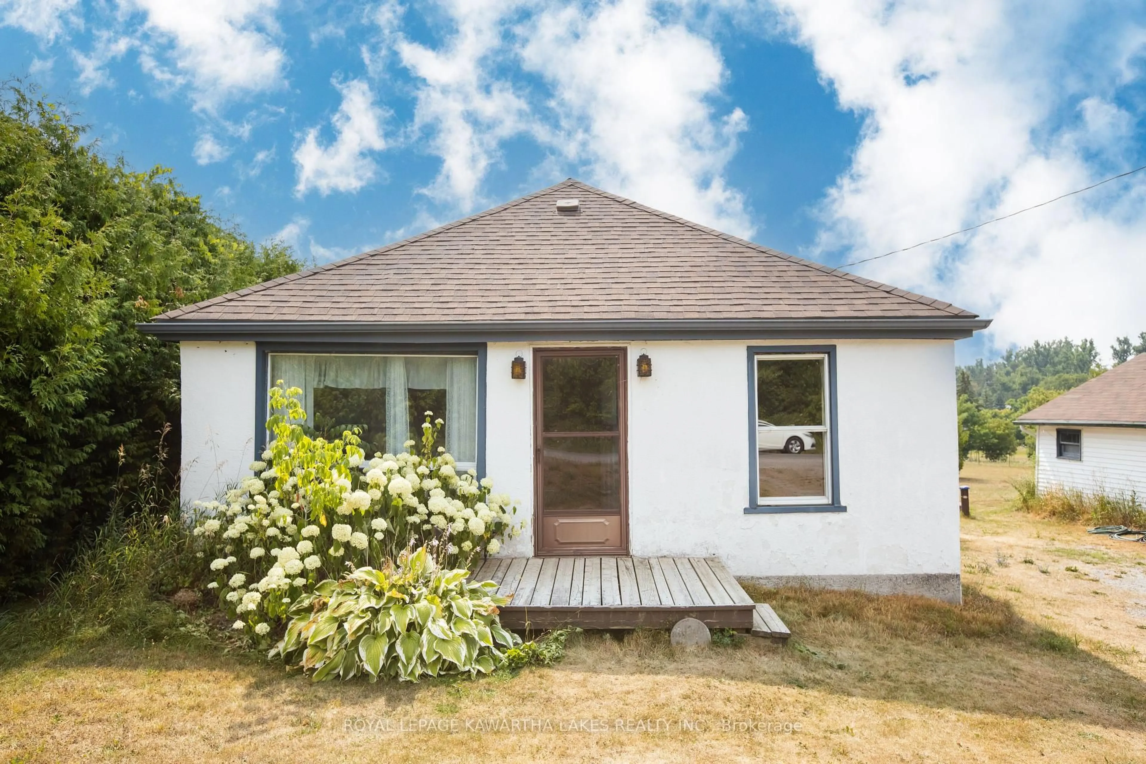 Home with vinyl exterior material, street for 221 Pleasant Point Rd, Kawartha Lakes Ontario K9V 4R6