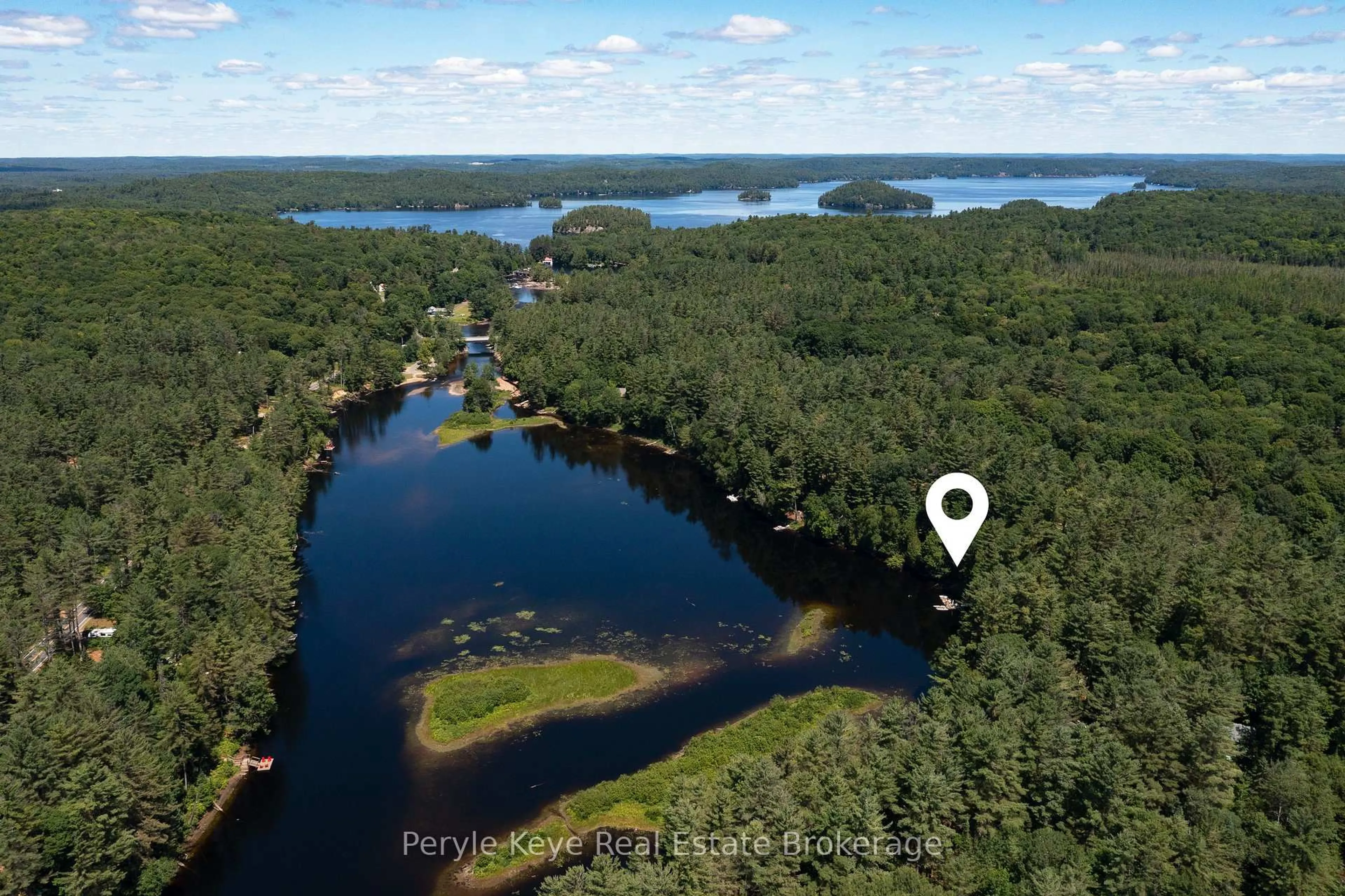 A pic from outside/outdoor area/front of a property/back of a property/a pic from drone, water/lake/river/ocean view for 136 Deer Lake Rd, Huntsville Ontario P0B 1L0