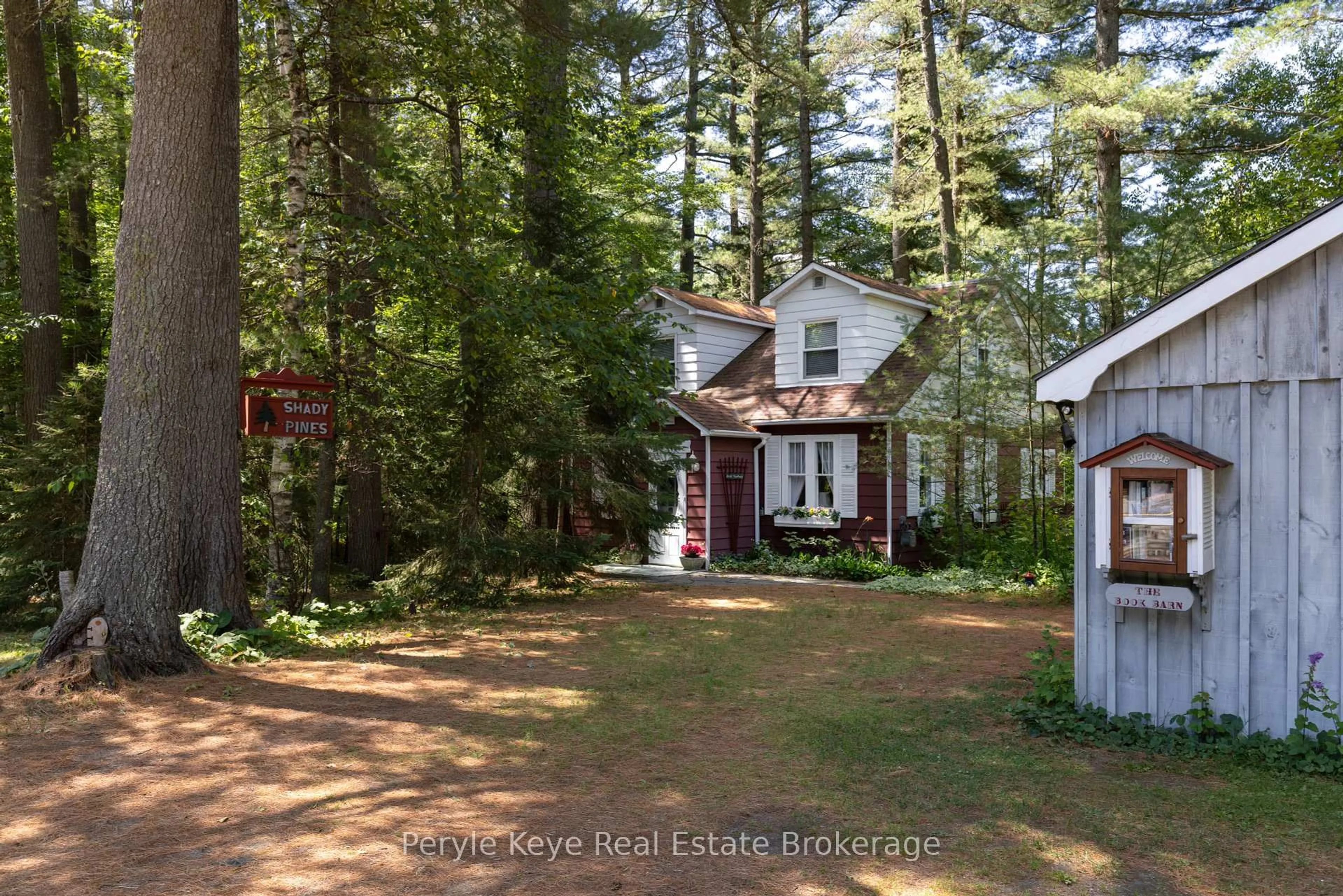 A pic from outside/outdoor area/front of a property/back of a property/a pic from drone, forest/trees view for 136 Deer Lake Rd, Huntsville Ontario P0B 1L0