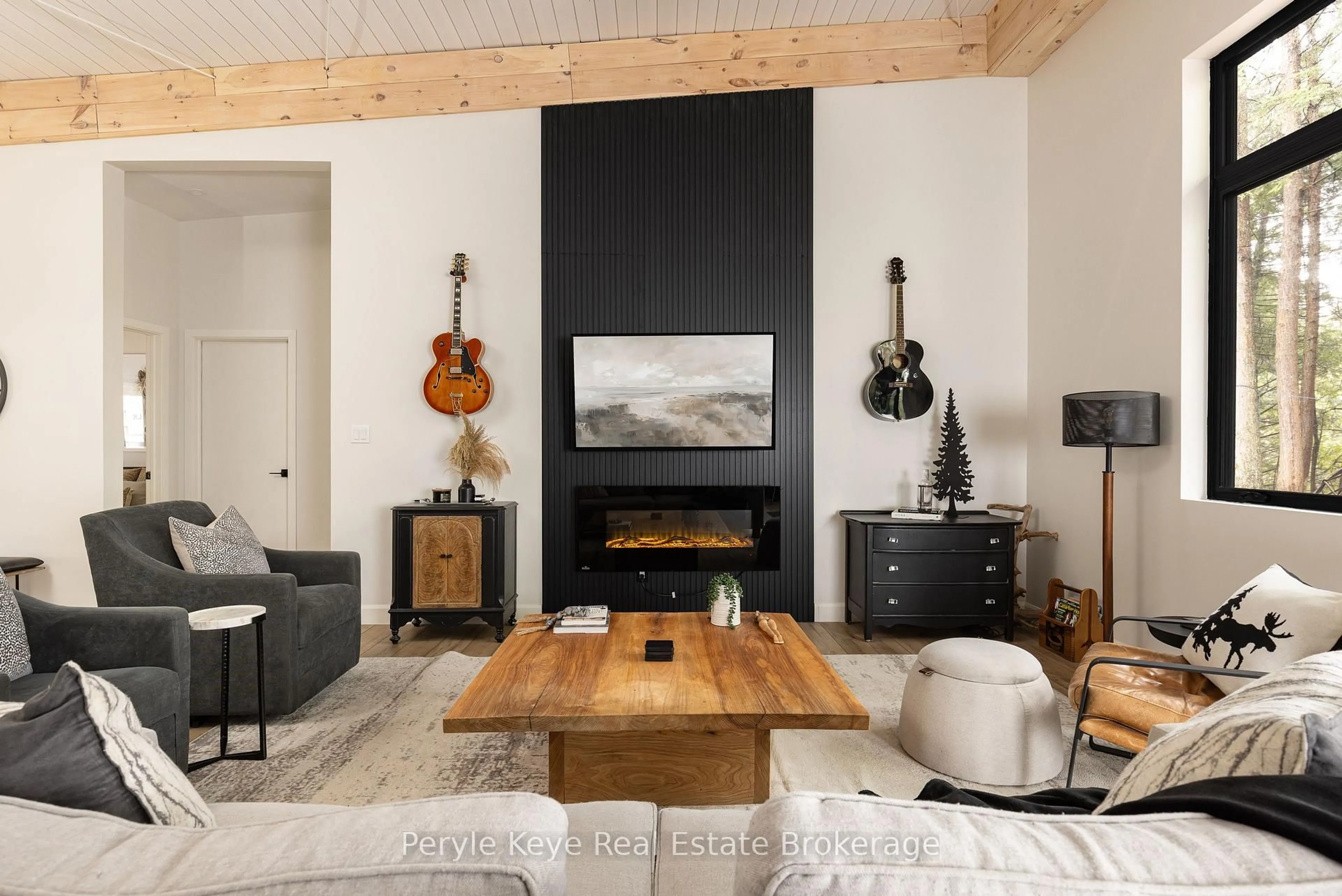 Living room with furniture, wood/laminate floor for 1-1387 Oxbow Lake Rd, Lake of Bays Ontario P1H 2J6