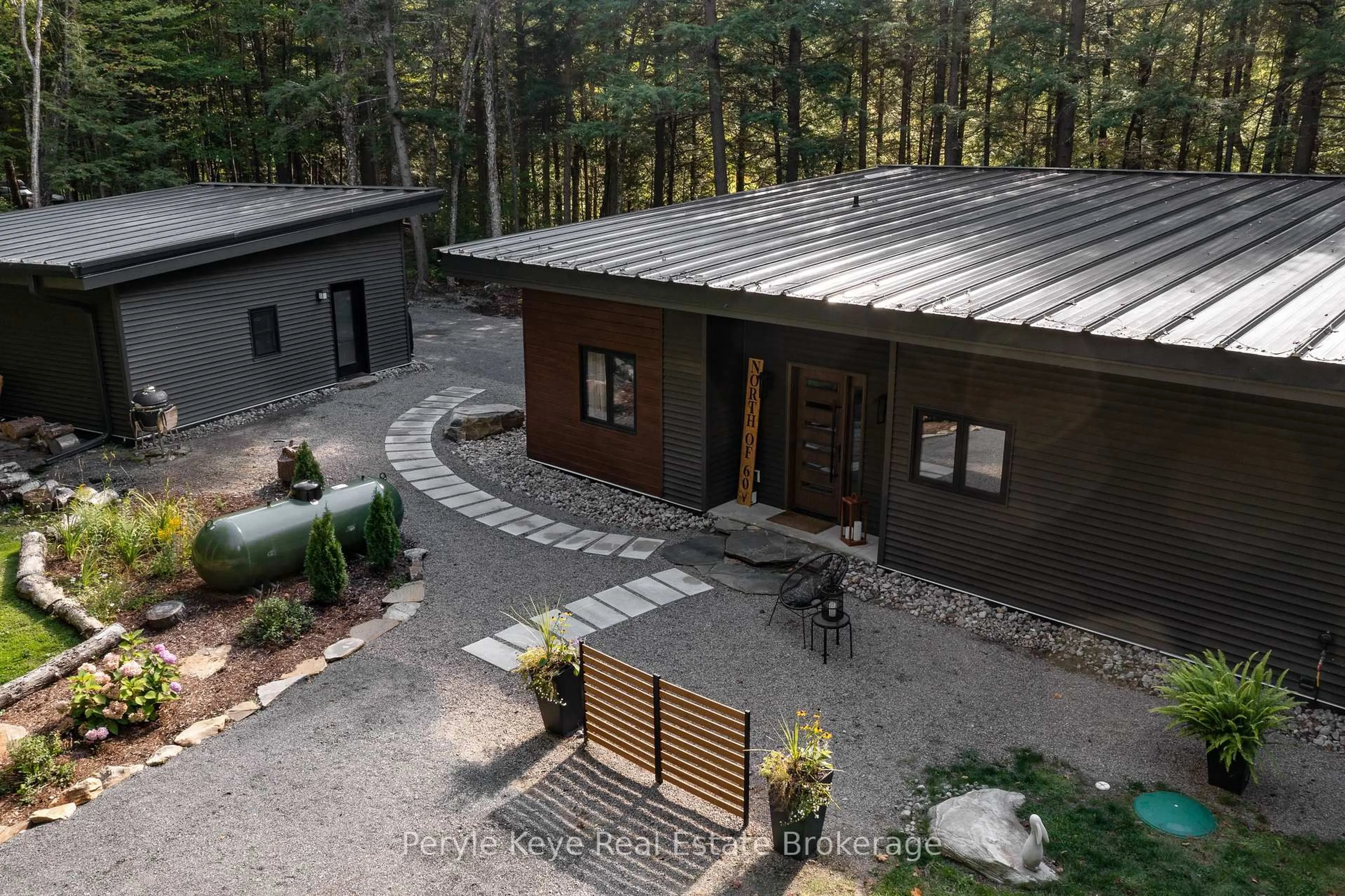 A pic from outside/outdoor area/front of a property/back of a property/a pic from drone, forest/trees view for 1-1387 Oxbow Lake Rd, Lake of Bays Ontario P1H 2J6