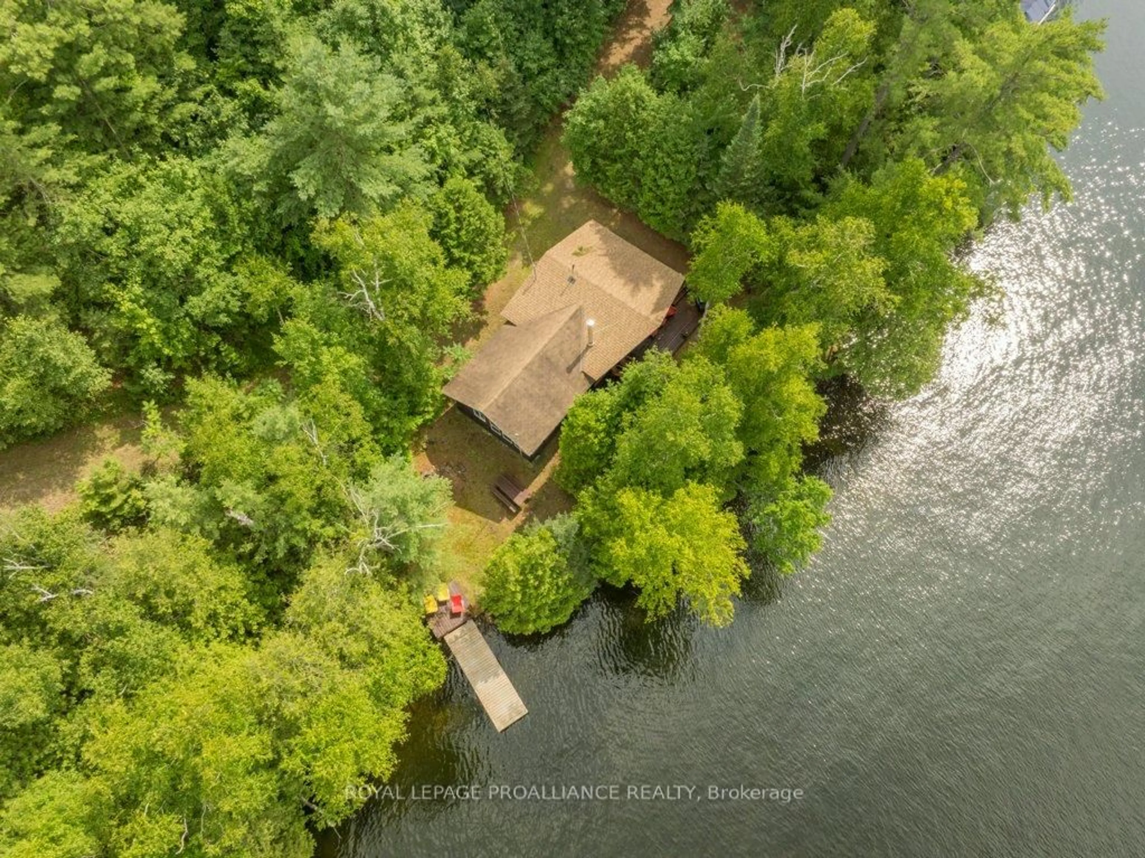 A pic from outside/outdoor area/front of a property/back of a property/a pic from drone, water/lake/river/ocean view for 1021 Blue Jay Lane, Arden Ontario K0H 1B0