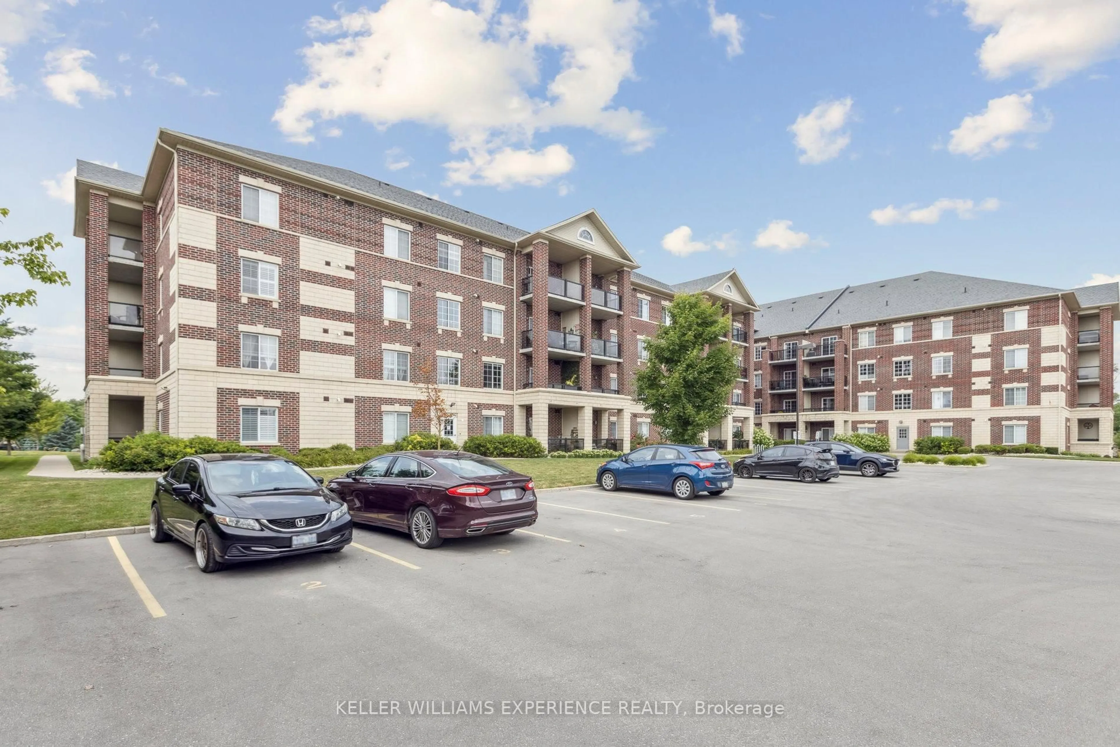 A pic from outside/outdoor area/front of a property/back of a property/a pic from drone, unknown for 308 Watson Pkwy #301, Guelph Ontario N1E 0G7