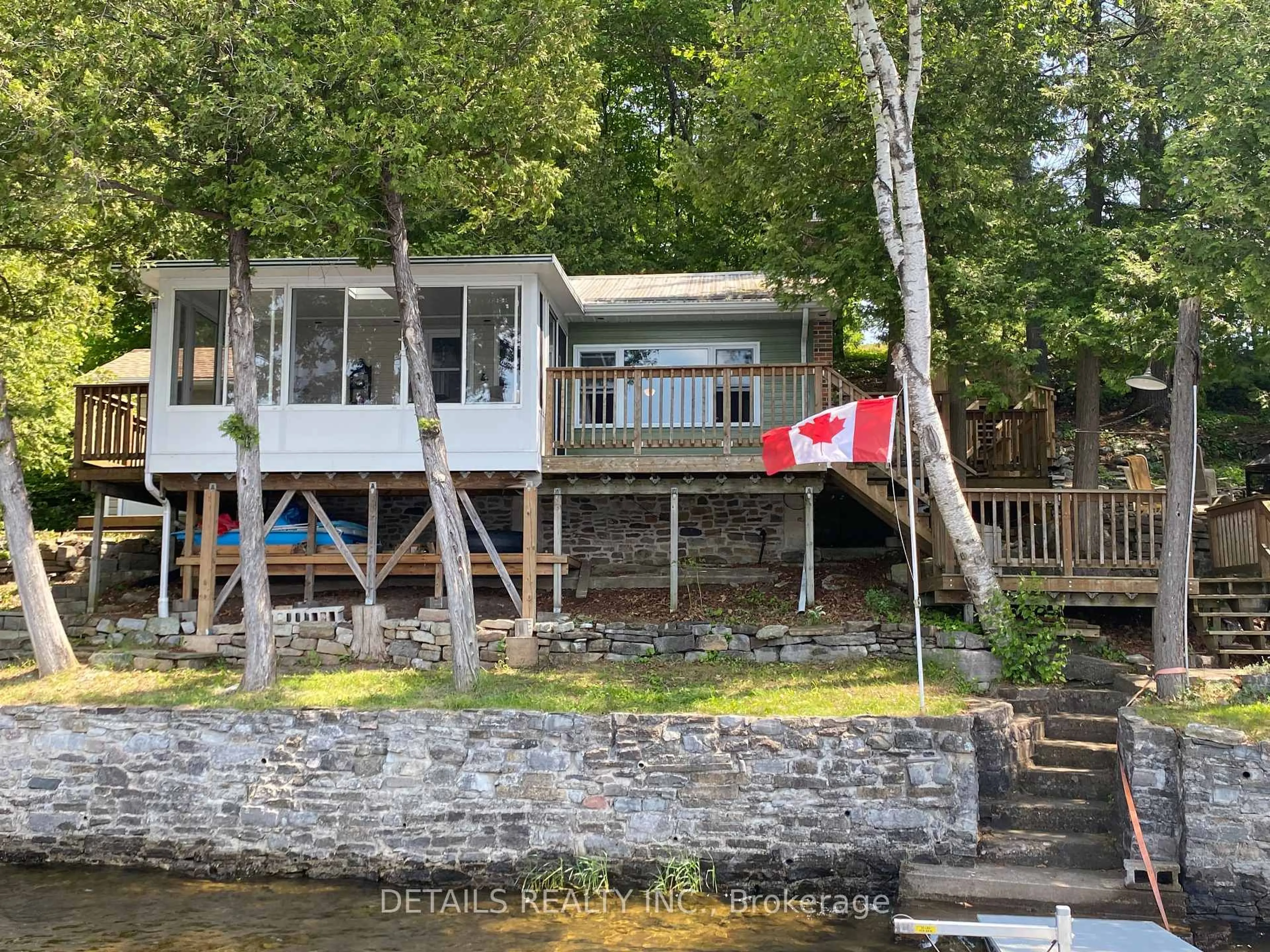 A pic from outside/outdoor area/front of a property/back of a property/a pic from drone, water/lake/river/ocean view for 63 Gordon Crt, Madoc Ontario K0K 2K0