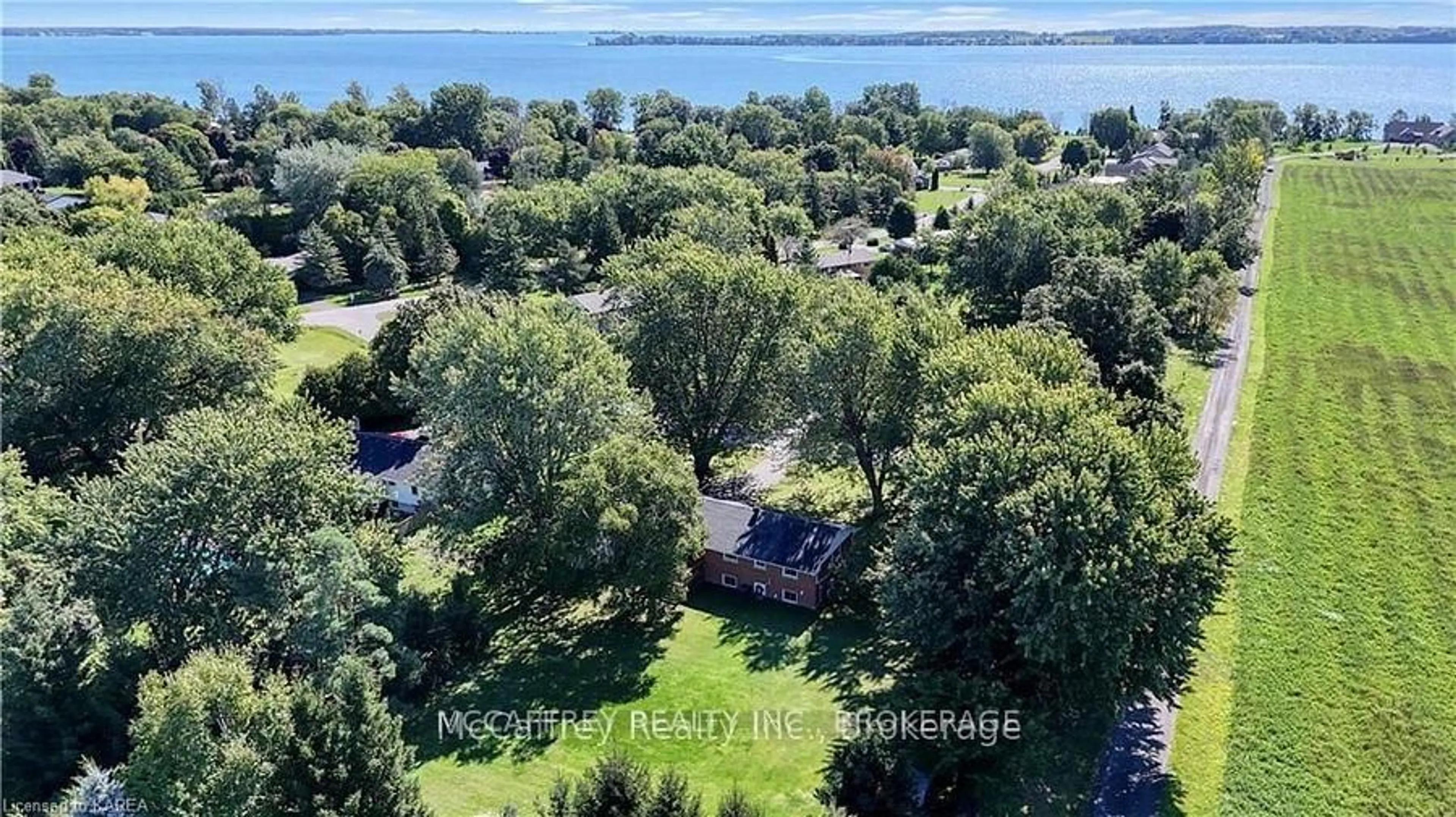 A pic from outside/outdoor area/front of a property/back of a property/a pic from drone, water/lake/river/ocean view for 102 WRIGHT Pl, Bath Ontario K0H 1G0