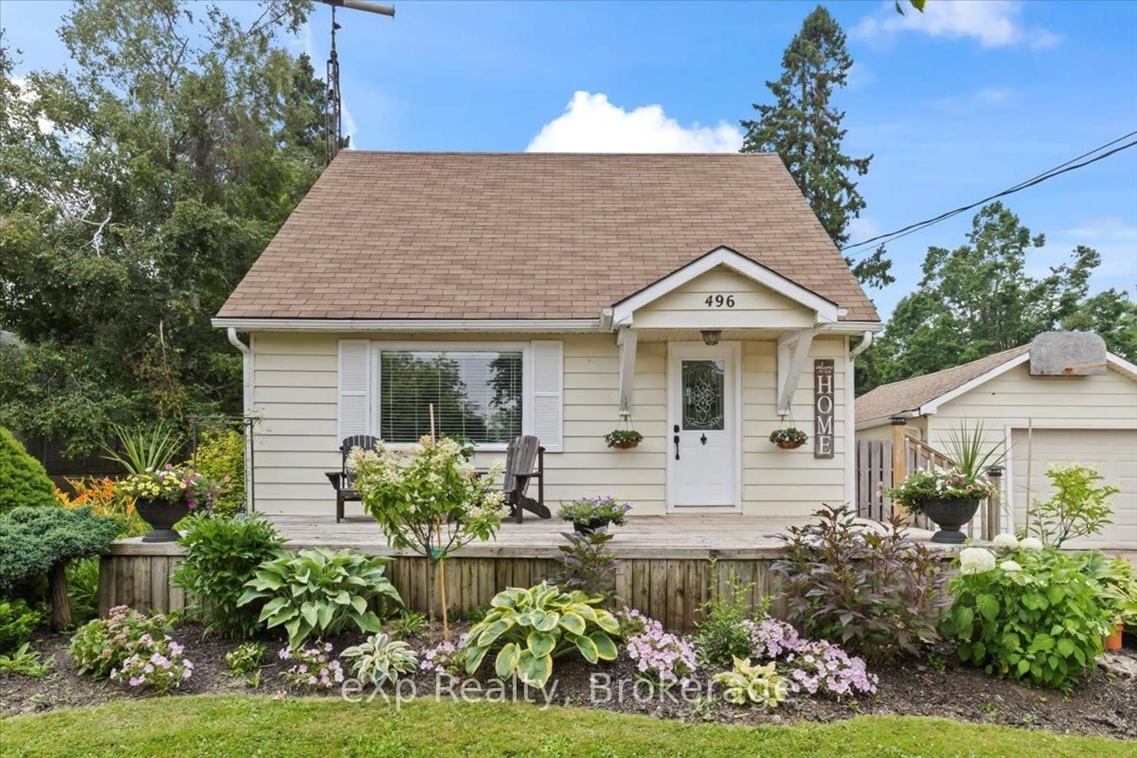 Home with vinyl exterior material, street for 496 Main St, Southgate Ontario N0C 1B0