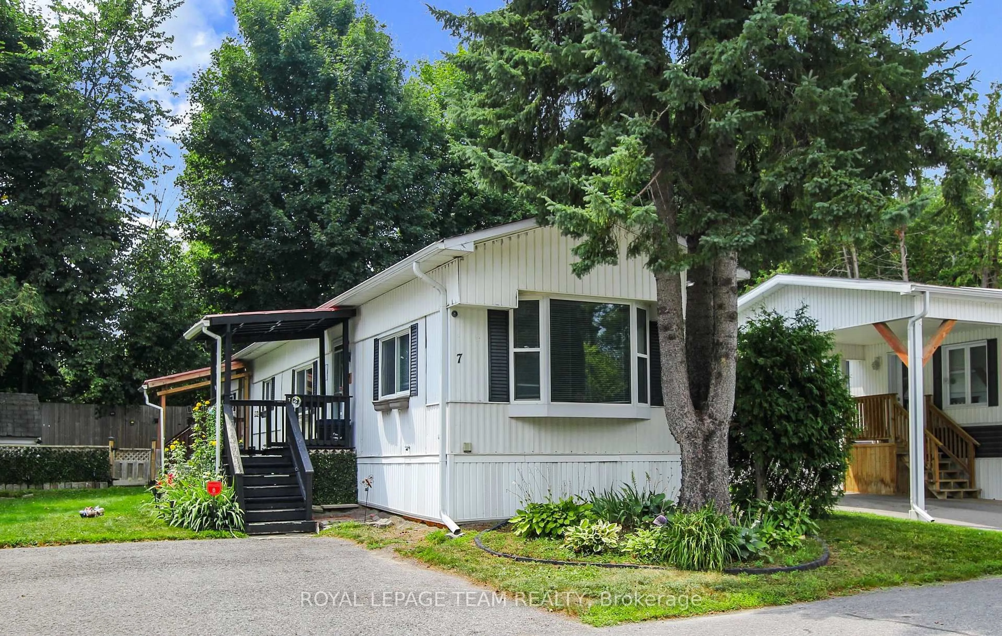 Home with vinyl exterior material, street for 7 Rowan Rd, Ottawa Ontario K2S 1B7