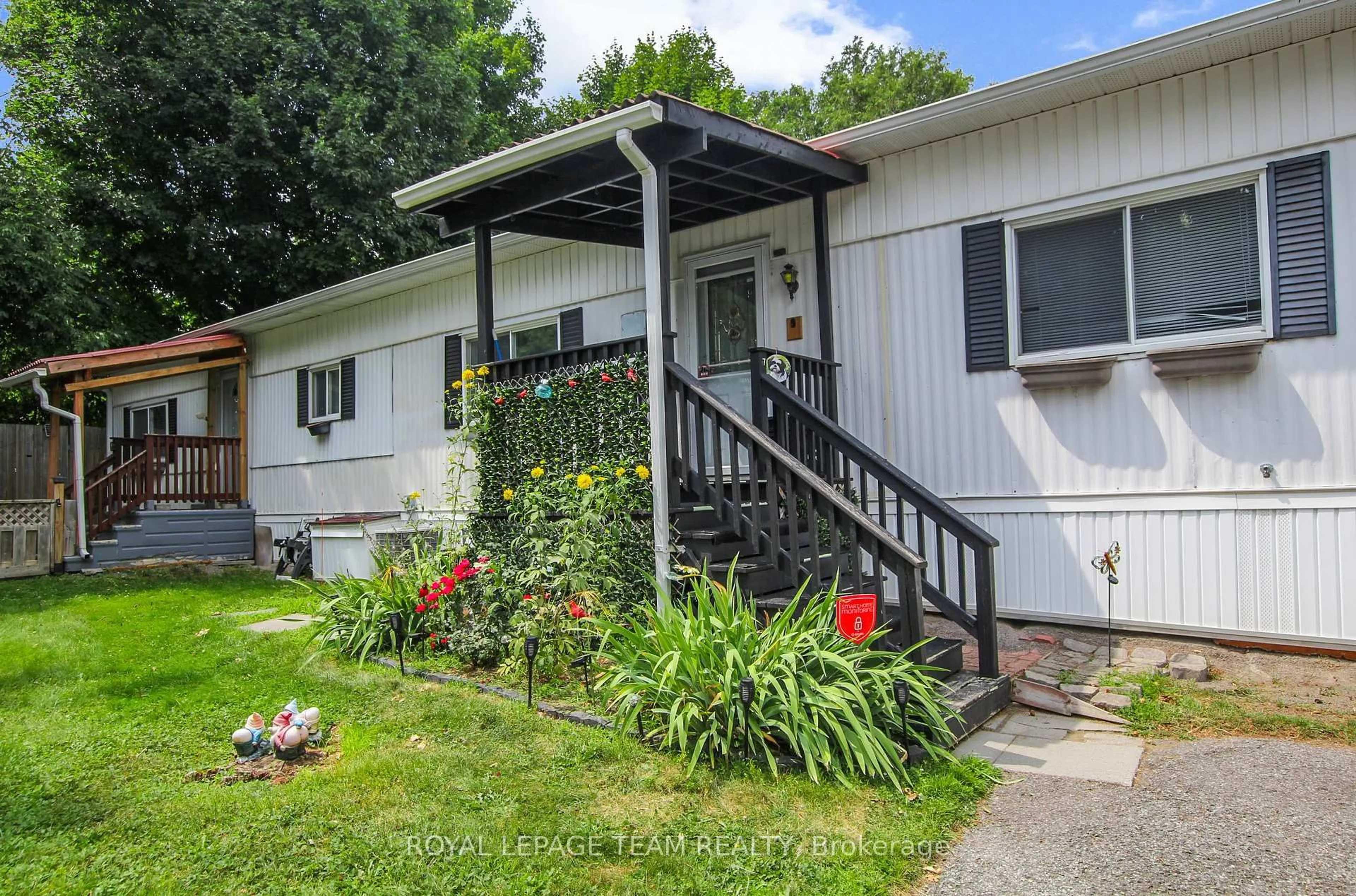 Home with vinyl exterior material, street for 7 Rowan Rd, Ottawa Ontario K2S 1B7