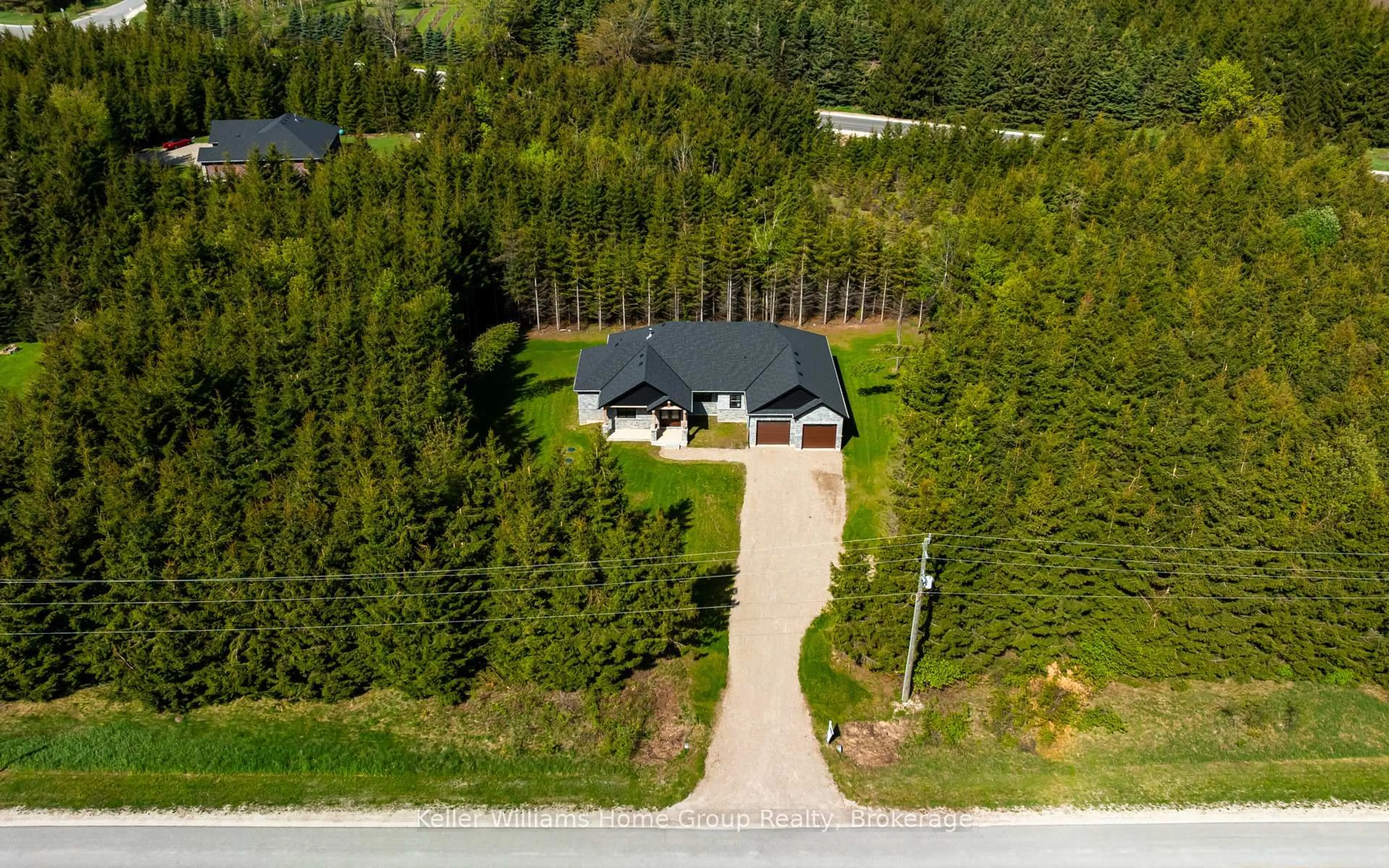 A pic from outside/outdoor area/front of a property/back of a property/a pic from drone, forest/trees view for 537266 Main St, Melancthon Ontario L0N 1J0