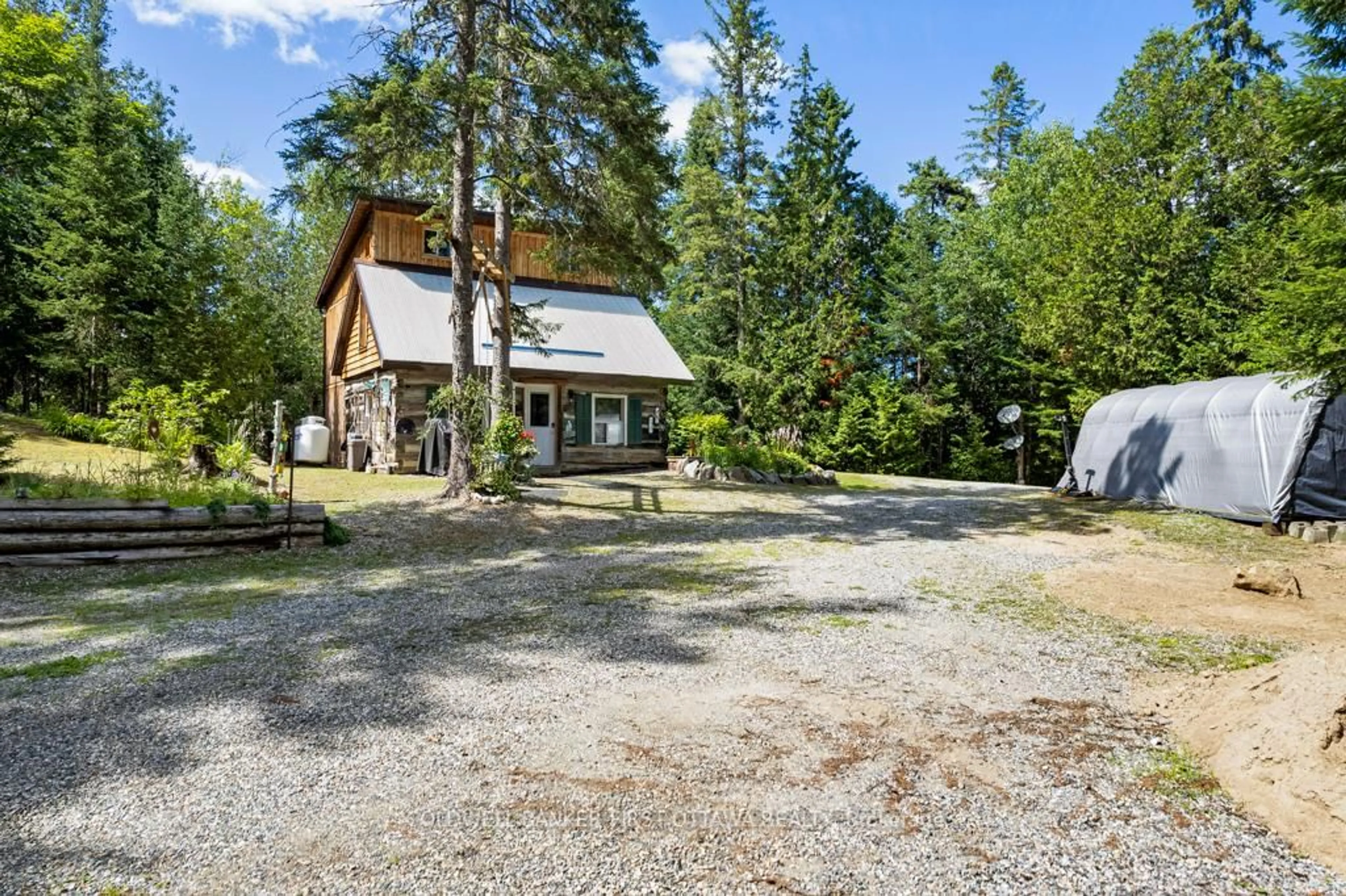 A pic from outside/outdoor area/front of a property/back of a property/a pic from drone, unknown for 1169 Mosque Lake Rd, Ompah Ontario K0H 2J0