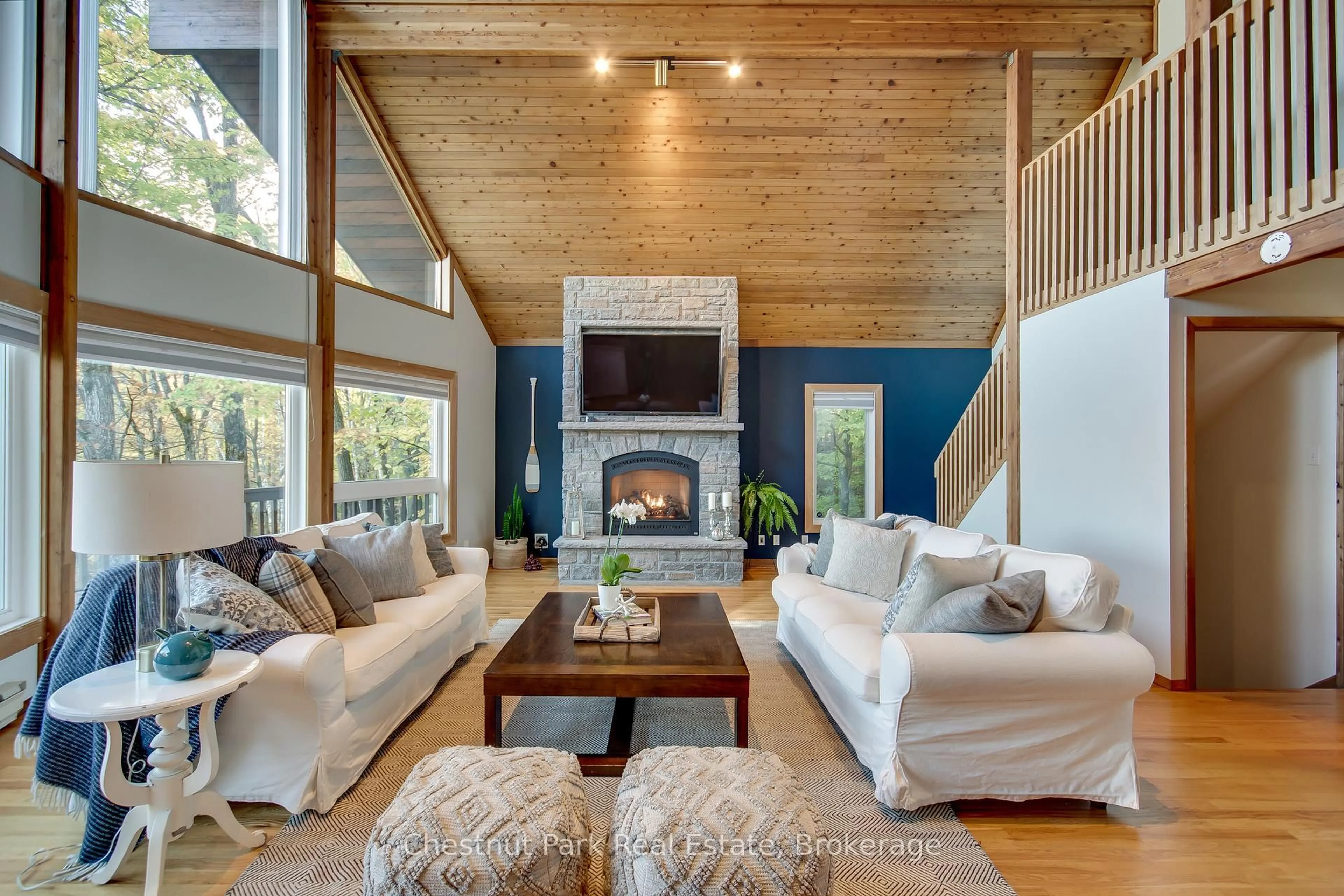 Living room with furniture, wood/laminate floor for 1033 Point Ideal Rd, Lake of Bays Ontario P0A 1H0
