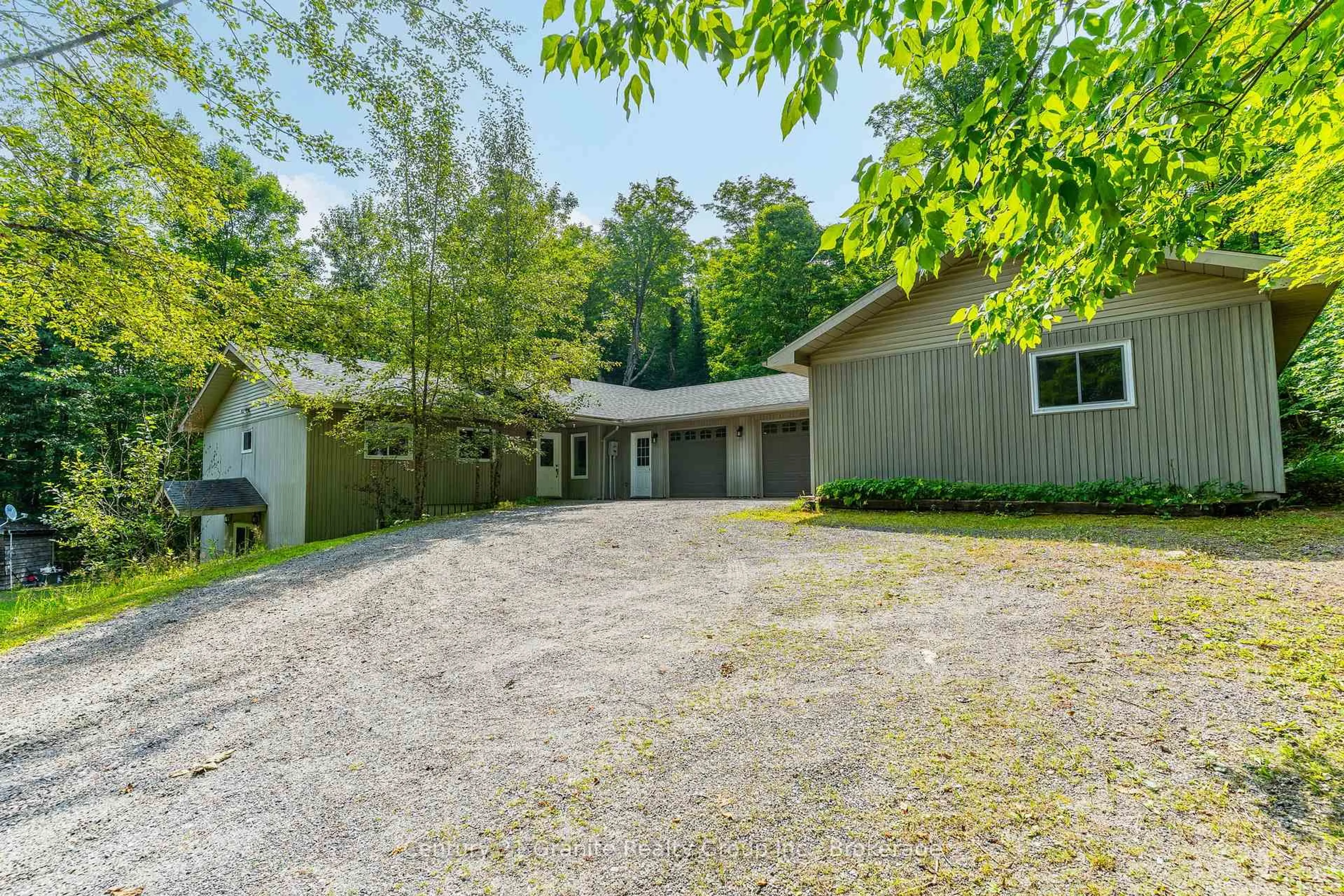 A pic from outside/outdoor area/front of a property/back of a property/a pic from drone, street for 1029 Wigamog Rd, Minden Hills Ontario K0M 1S0