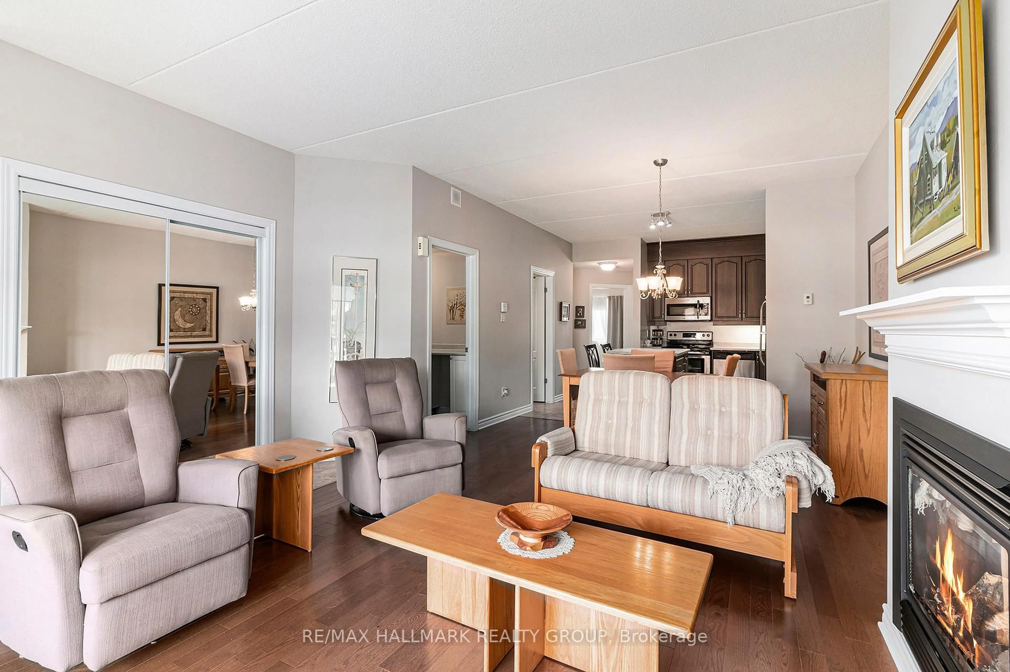 Living room with furniture, wood/laminate floor for 201 Eliot Dr #404, Clarence-Rockland Ontario K4K 0G4