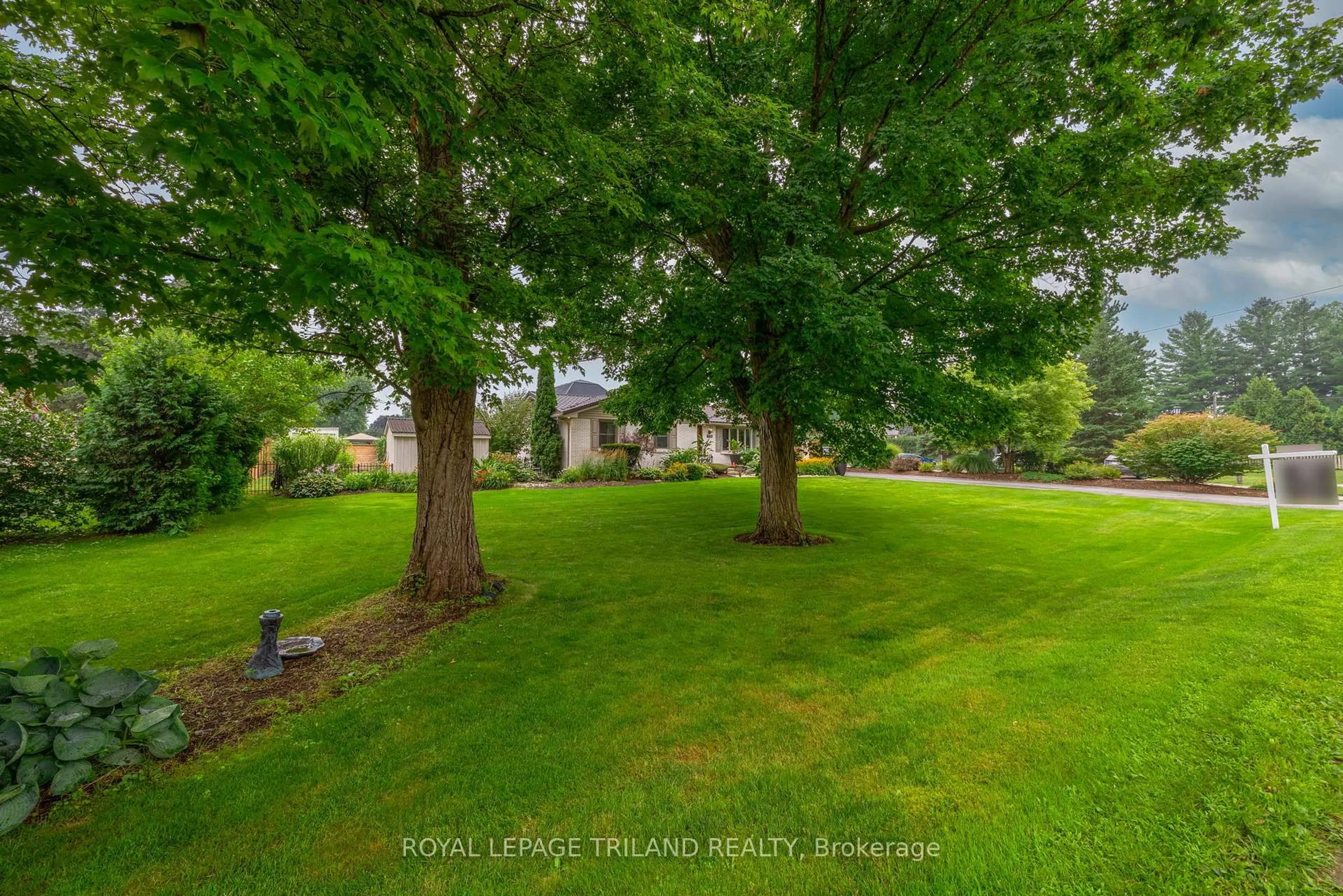 A pic from outside/outdoor area/front of a property/back of a property/a pic from drone, forest/trees view for 102 RAILWAY Ave, Middlesex Centre Ontario N0L 1R0
