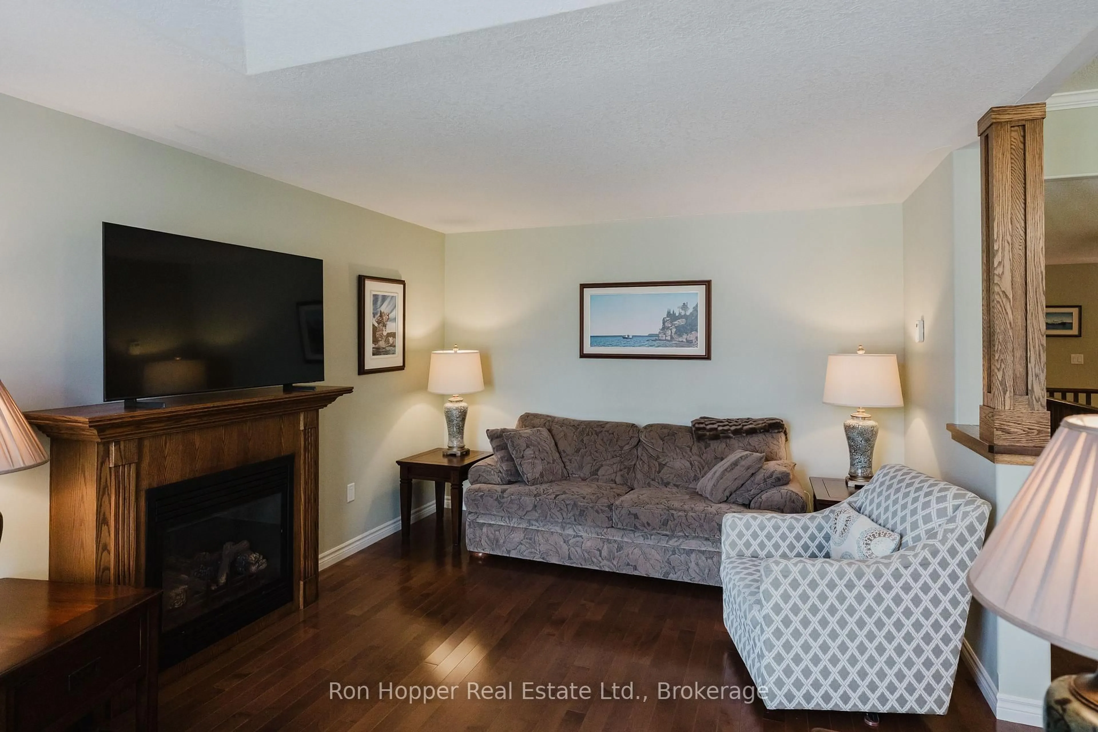 Living room with furniture, wood/laminate floor for 217 2nd St, Owen Sound Ontario N4K 0A6