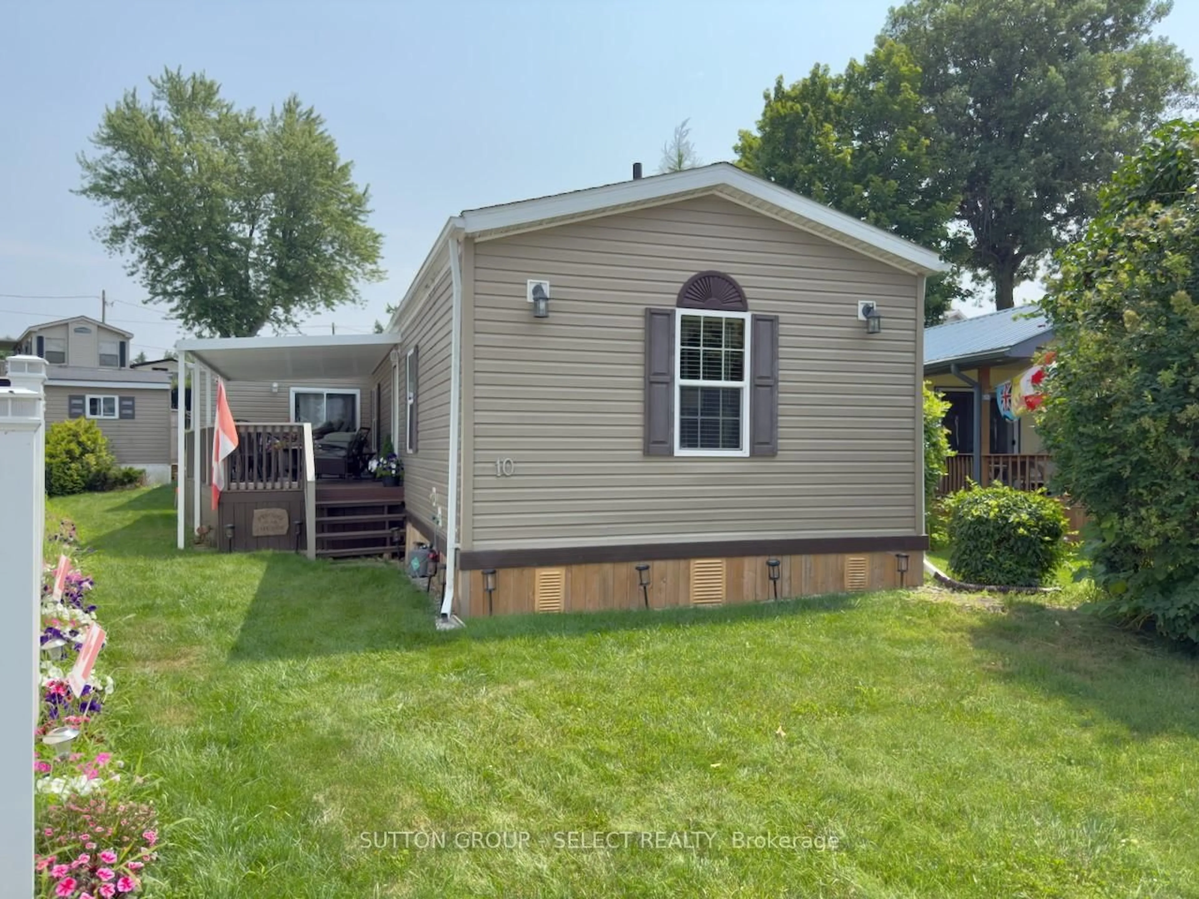 Home with vinyl exterior material, street for 10 CARIBBEAN Lane, Bluewater Ontario N0M 1N0