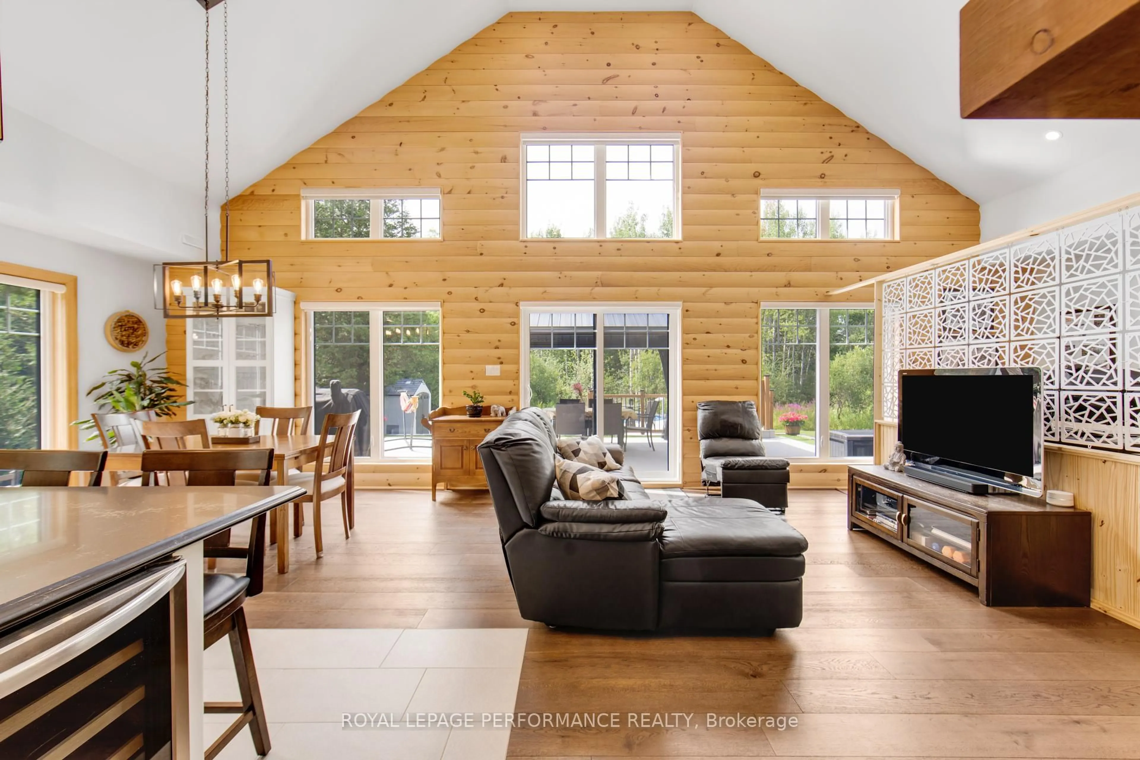 Living room with furniture, wood/laminate floor for 19442 Kenyon Rd Conc 1 Concession, North Glengarry Ontario K0C 1B0