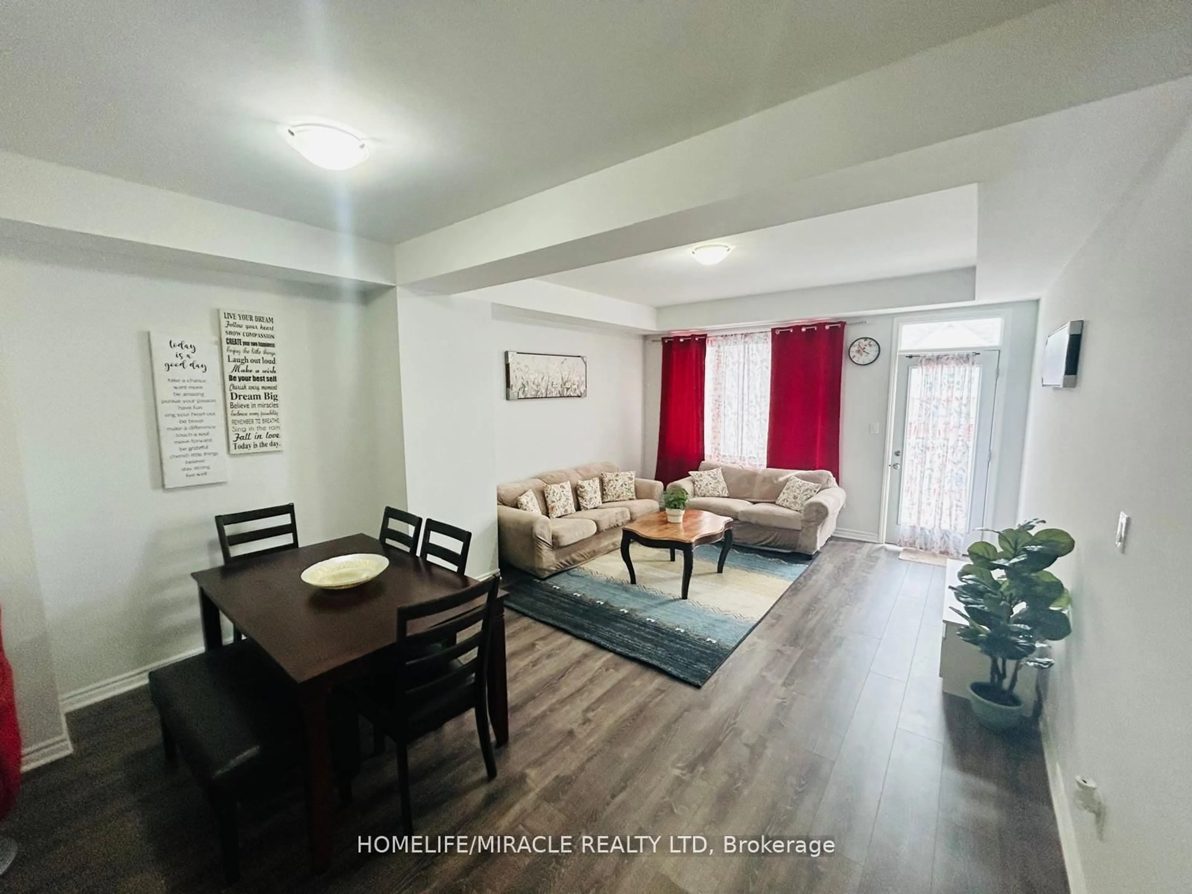 Living room with furniture, wood/laminate floor for 301 Equestrian Way, Cambridge Ontario N3E 0C7