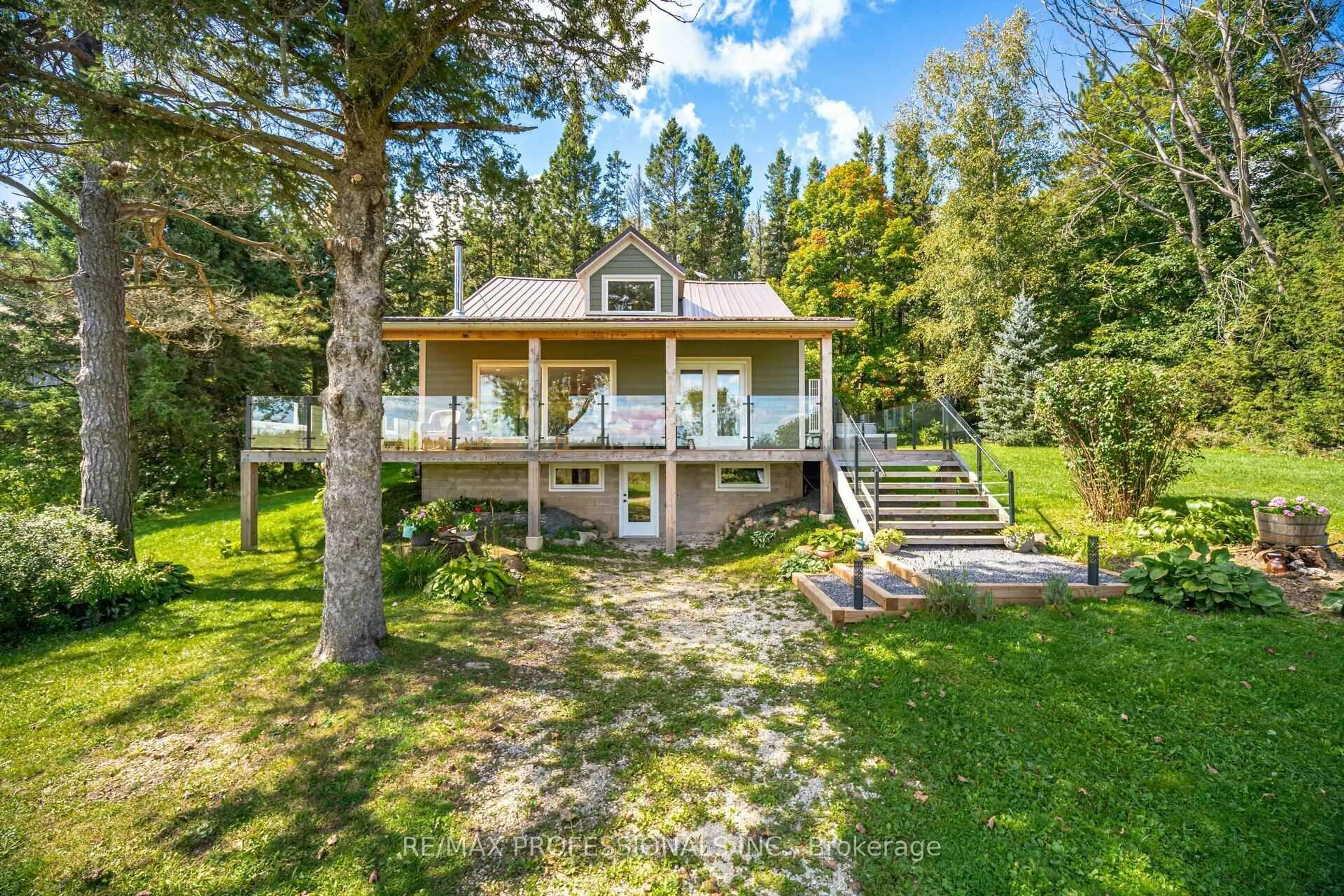 A pic from outside/outdoor area/front of a property/back of a property/a pic from drone, water/lake/river/ocean view for 135850 9th Line, Grey Highlands Ontario N0C 1H0