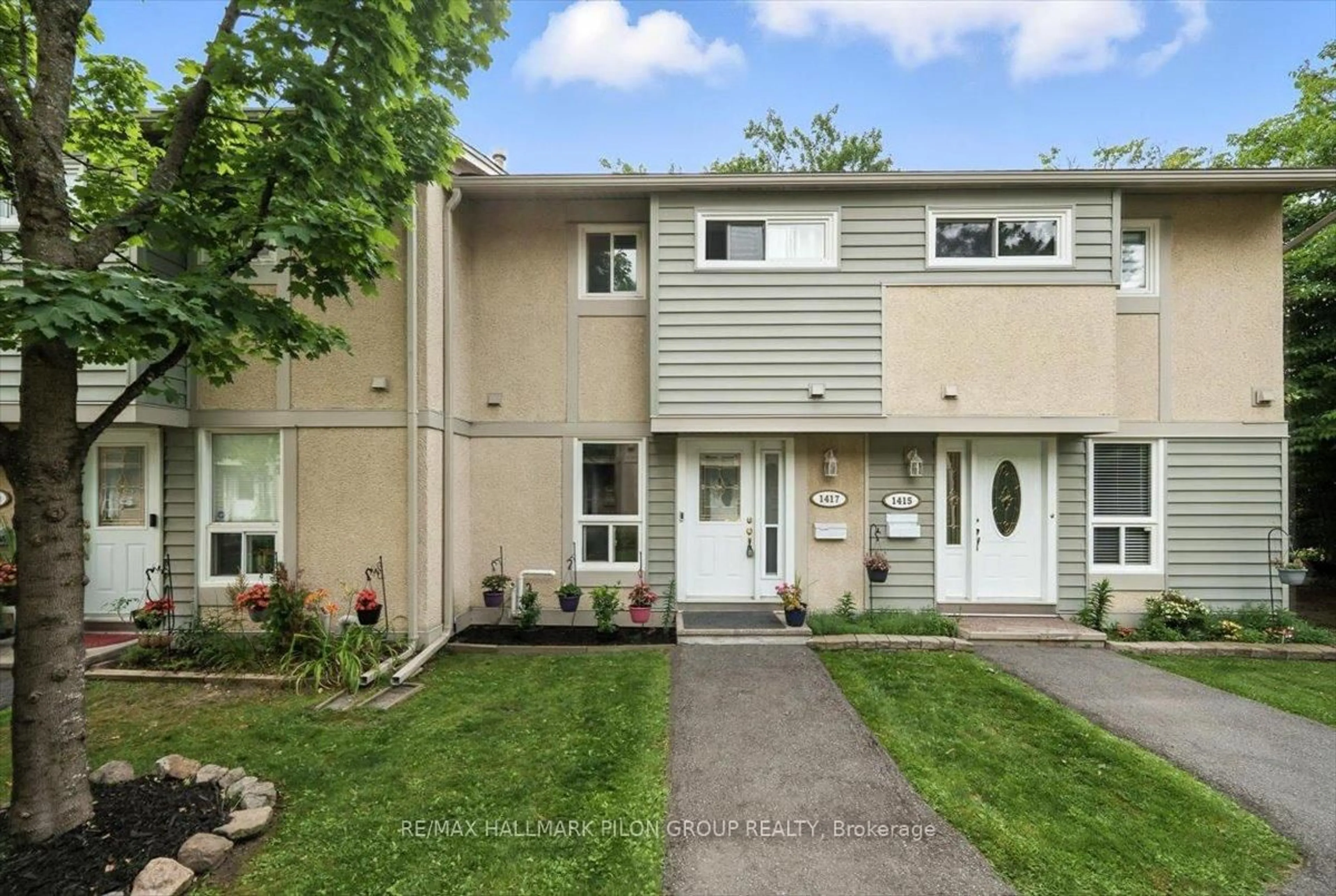 Home with vinyl exterior material, street for 1417 Ballard Crt, Ottawa Ontario K1B 4Y9