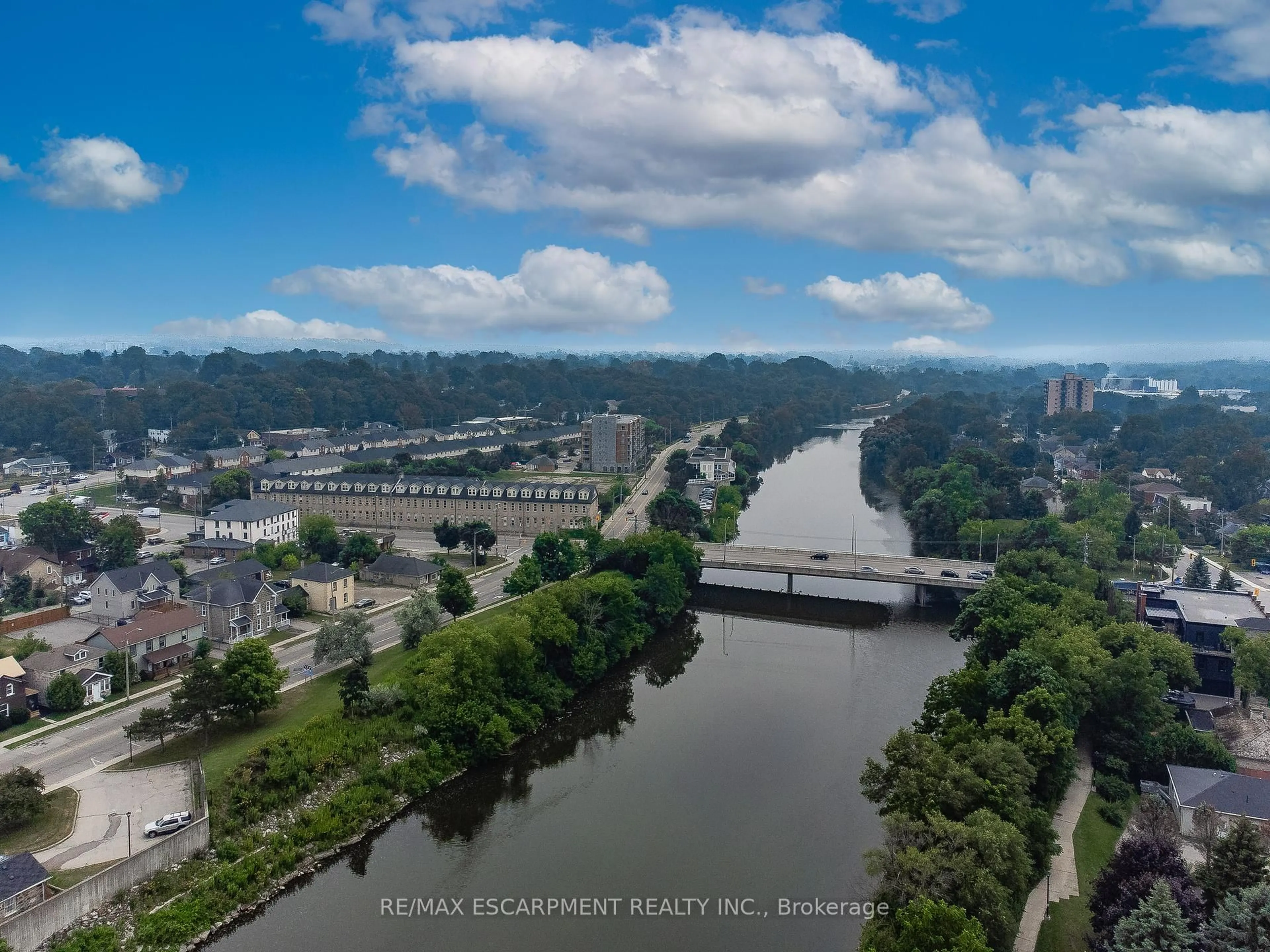 A pic from outside/outdoor area/front of a property/back of a property/a pic from drone, water/lake/river/ocean view for 25 Concession St #201, Cambridge Ontario N1R 2G6