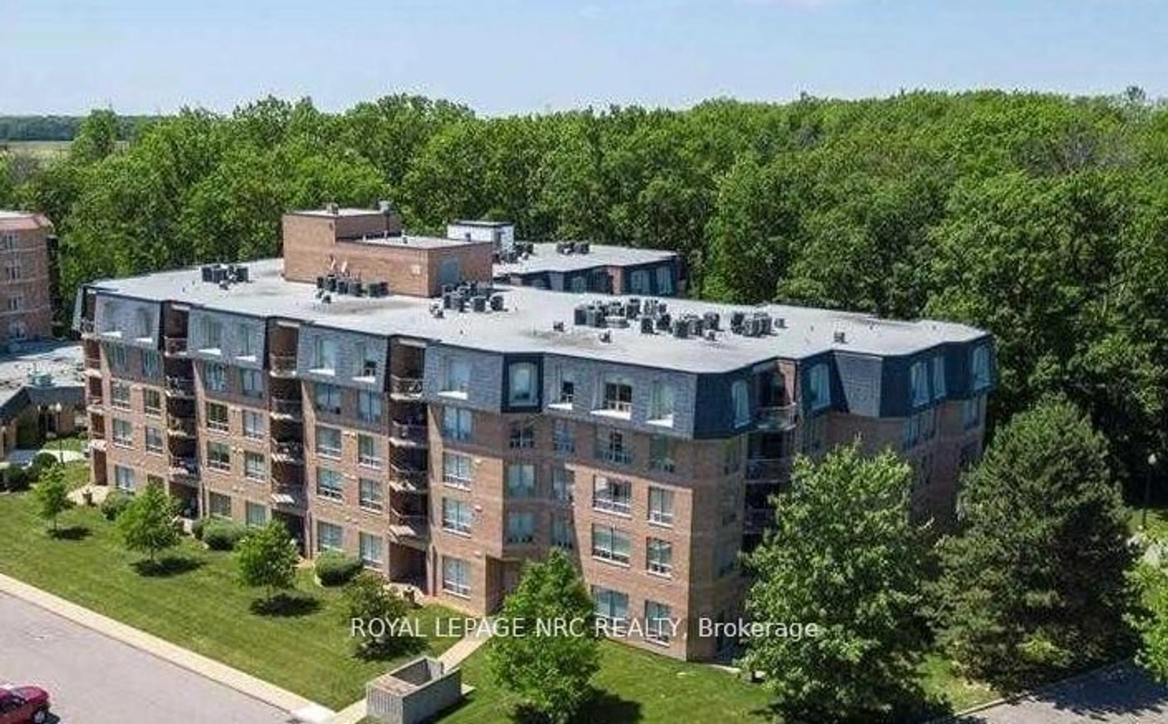 A pic from outside/outdoor area/front of a property/back of a property/a pic from drone, unknown for 8111 Forest Glen Dr #203, Niagara Falls Ontario L2H 2Y7