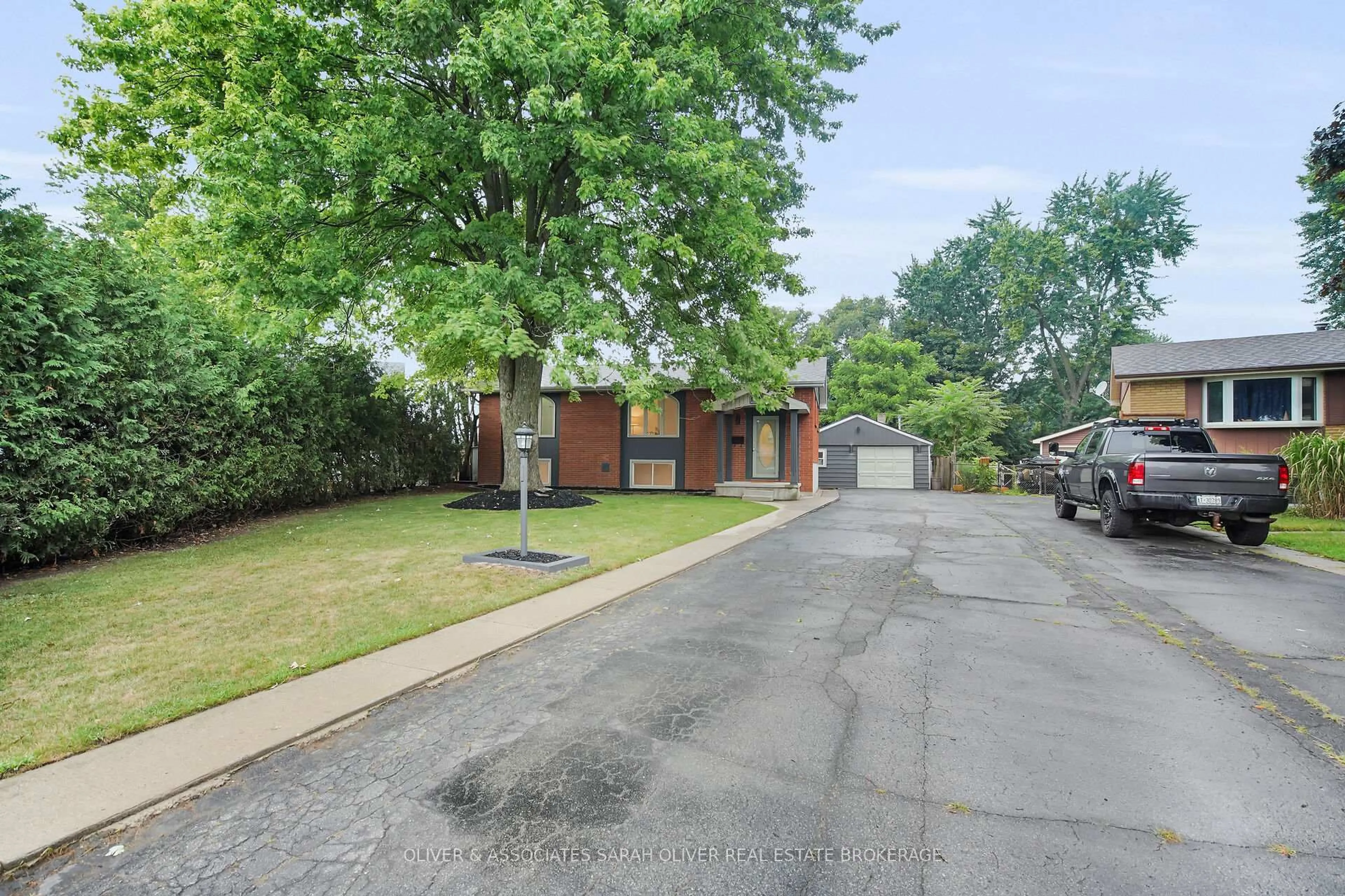 Home with brick exterior material, street for 15 Kenwood Cres, London East Ontario N5Y 3W6