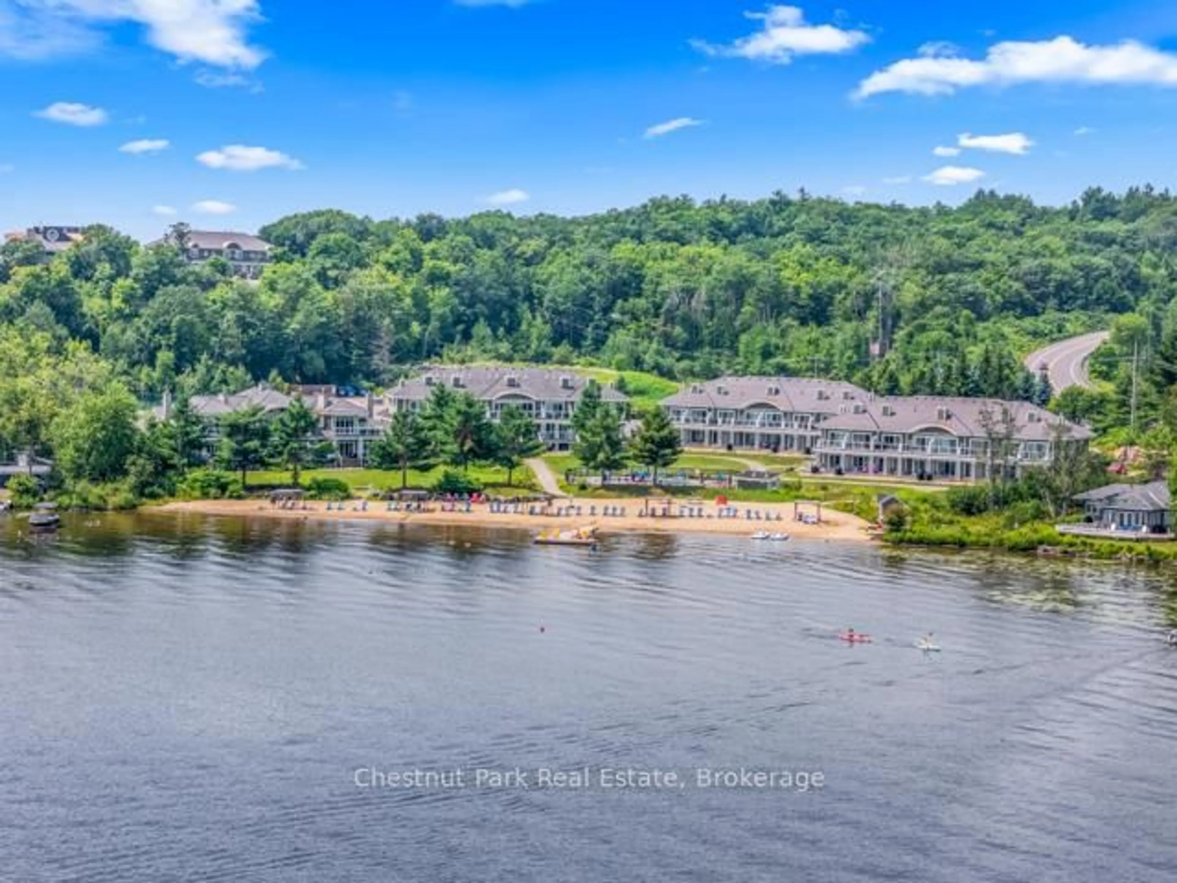 A pic from outside/outdoor area/front of a property/back of a property/a pic from drone, water/lake/river/ocean view for 1869 Muskoka Road 118 Rd #B206, Muskoka Lakes Ontario P1L 1W8