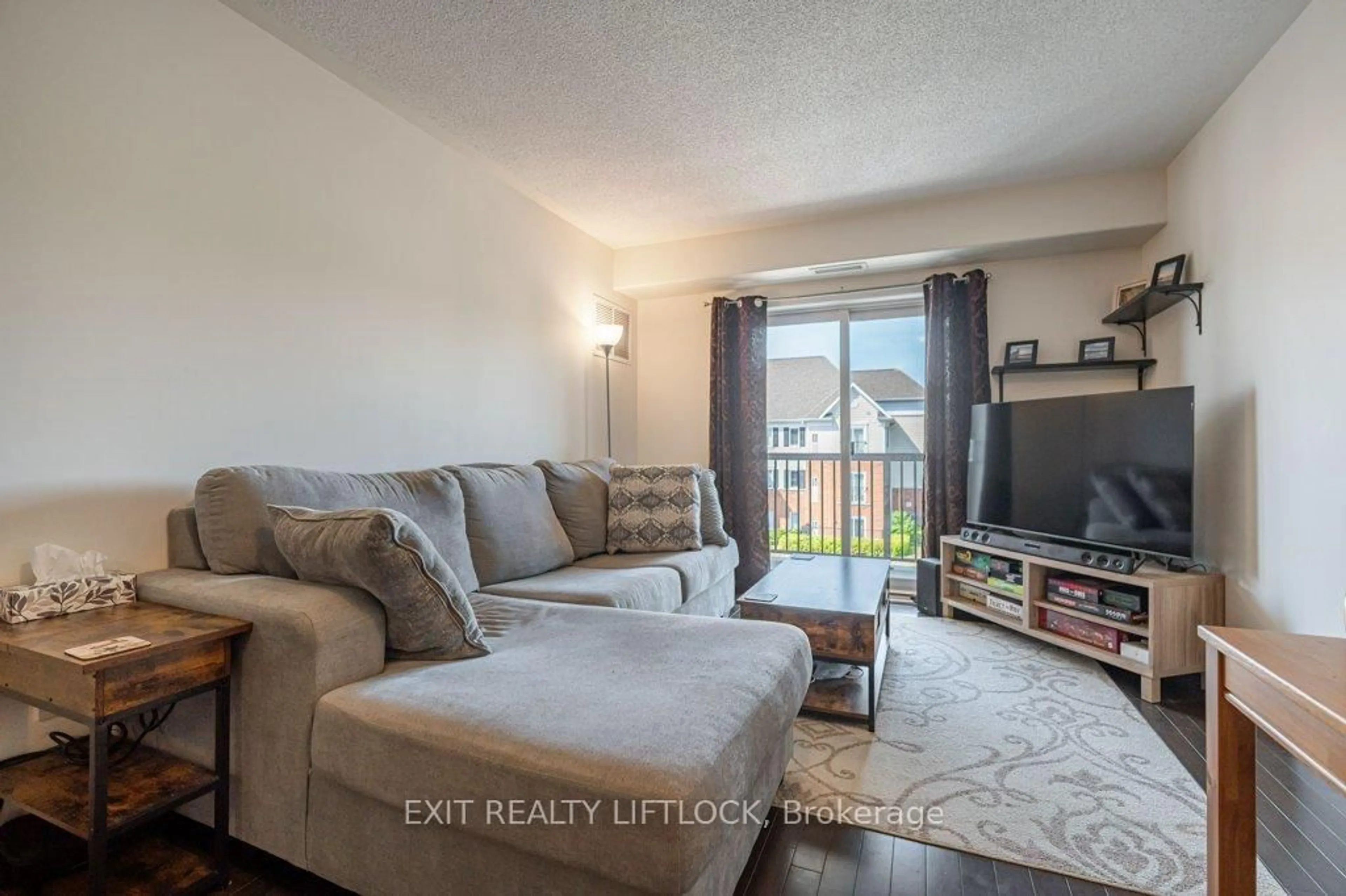 Living room with furniture, unknown for 312 Spillsbury Dr #303, Peterborough West Ontario K9K 0B6