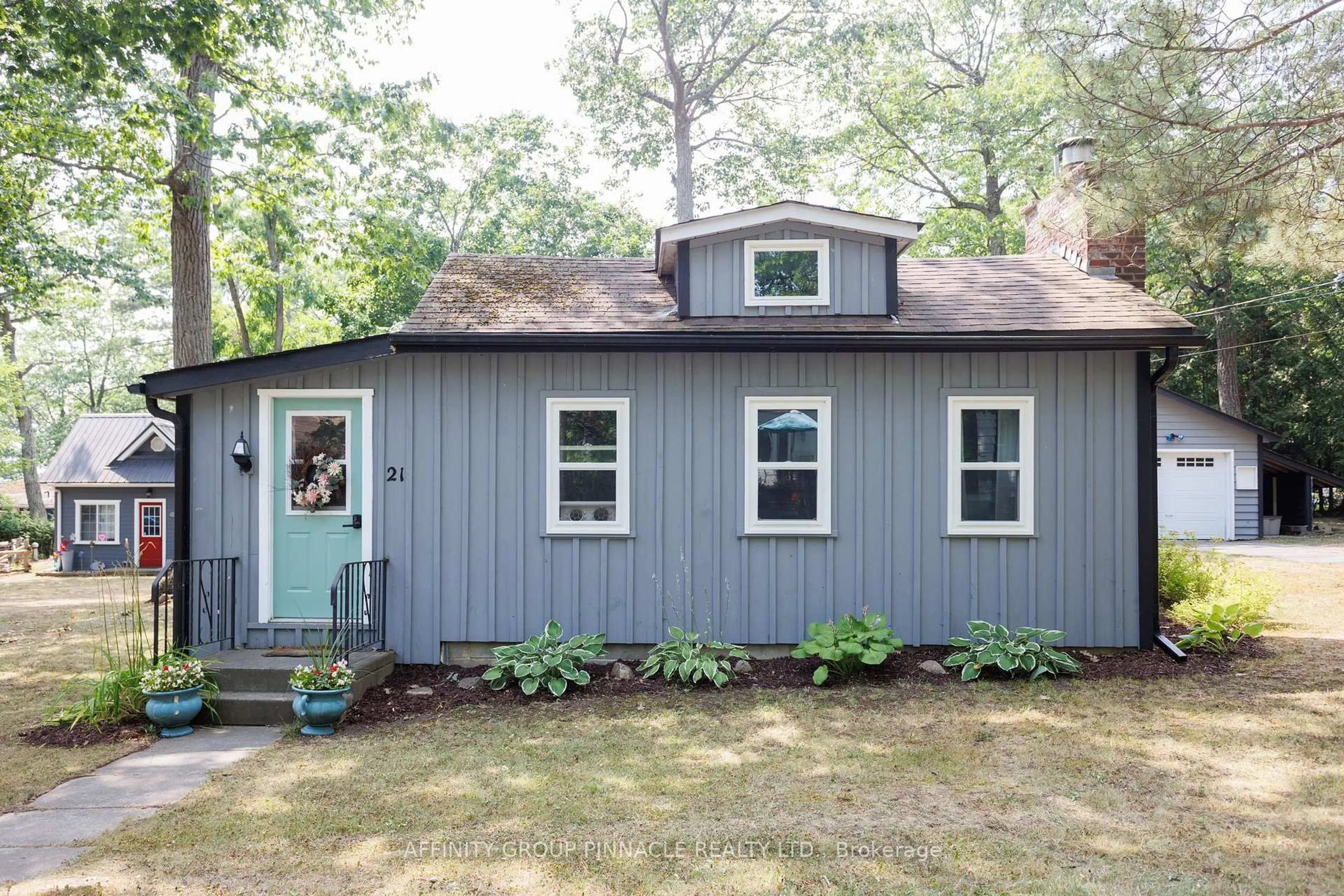 Home with vinyl exterior material, street for 21 4th St, Kawartha Lakes Ontario K0M 1N0