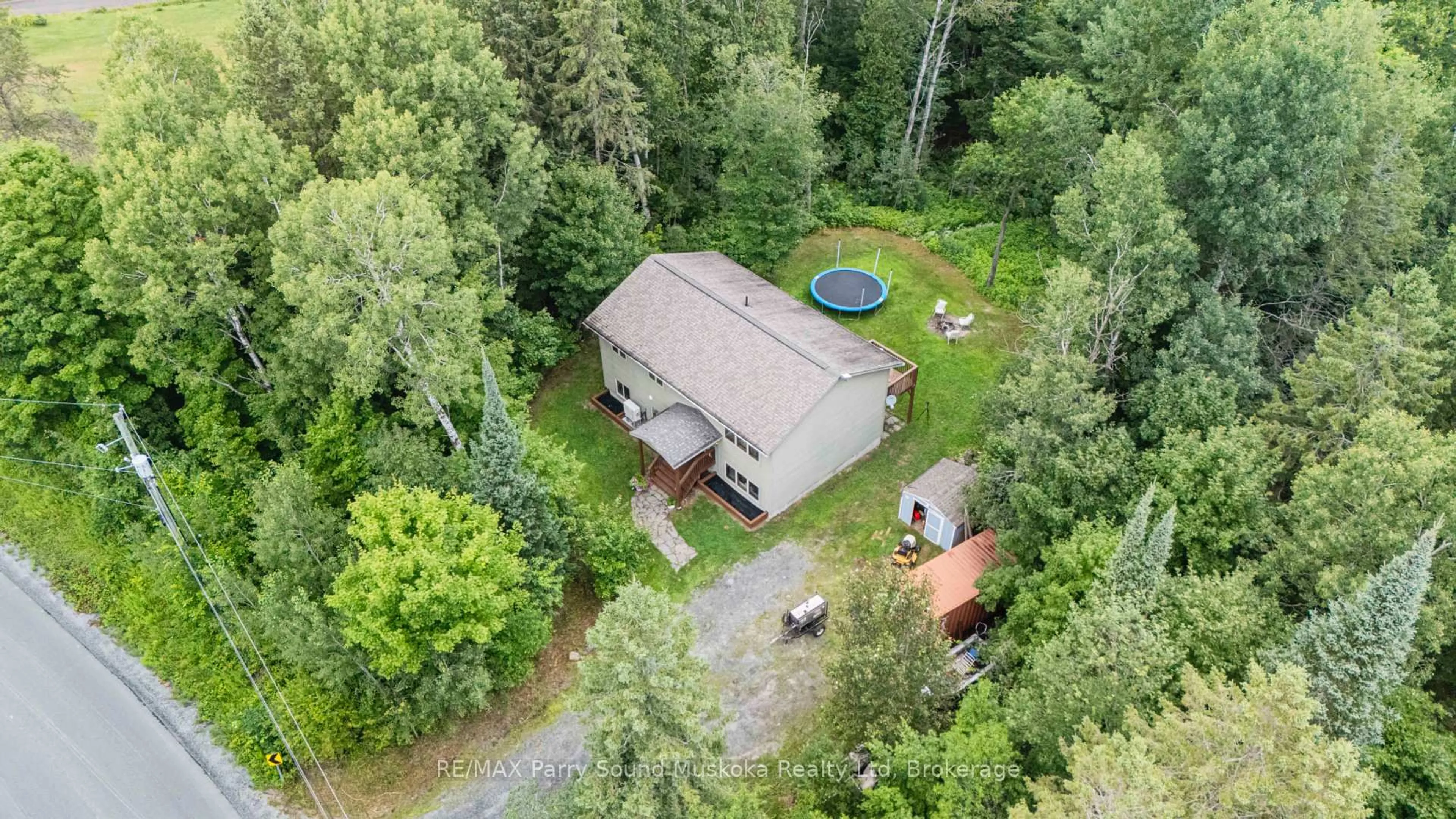 A pic from outside/outdoor area/front of a property/back of a property/a pic from drone, unknown for 312 Centre Rd, McKellar Ontario P2A 0B4
