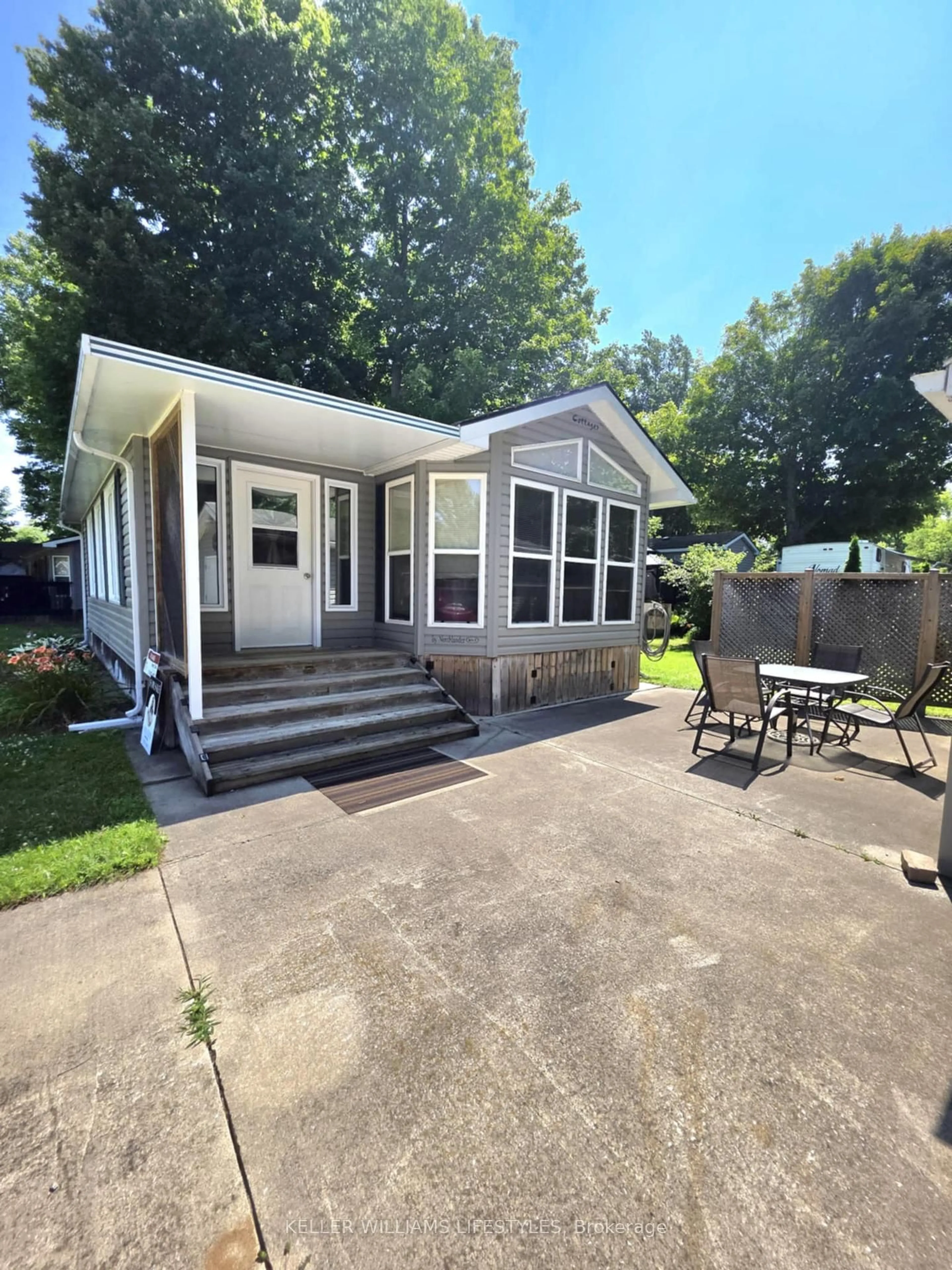 Home with vinyl exterior material, street for 9338 West Ipperwash Rd #JJ23, Lambton Shores Ontario N0N 1J2
