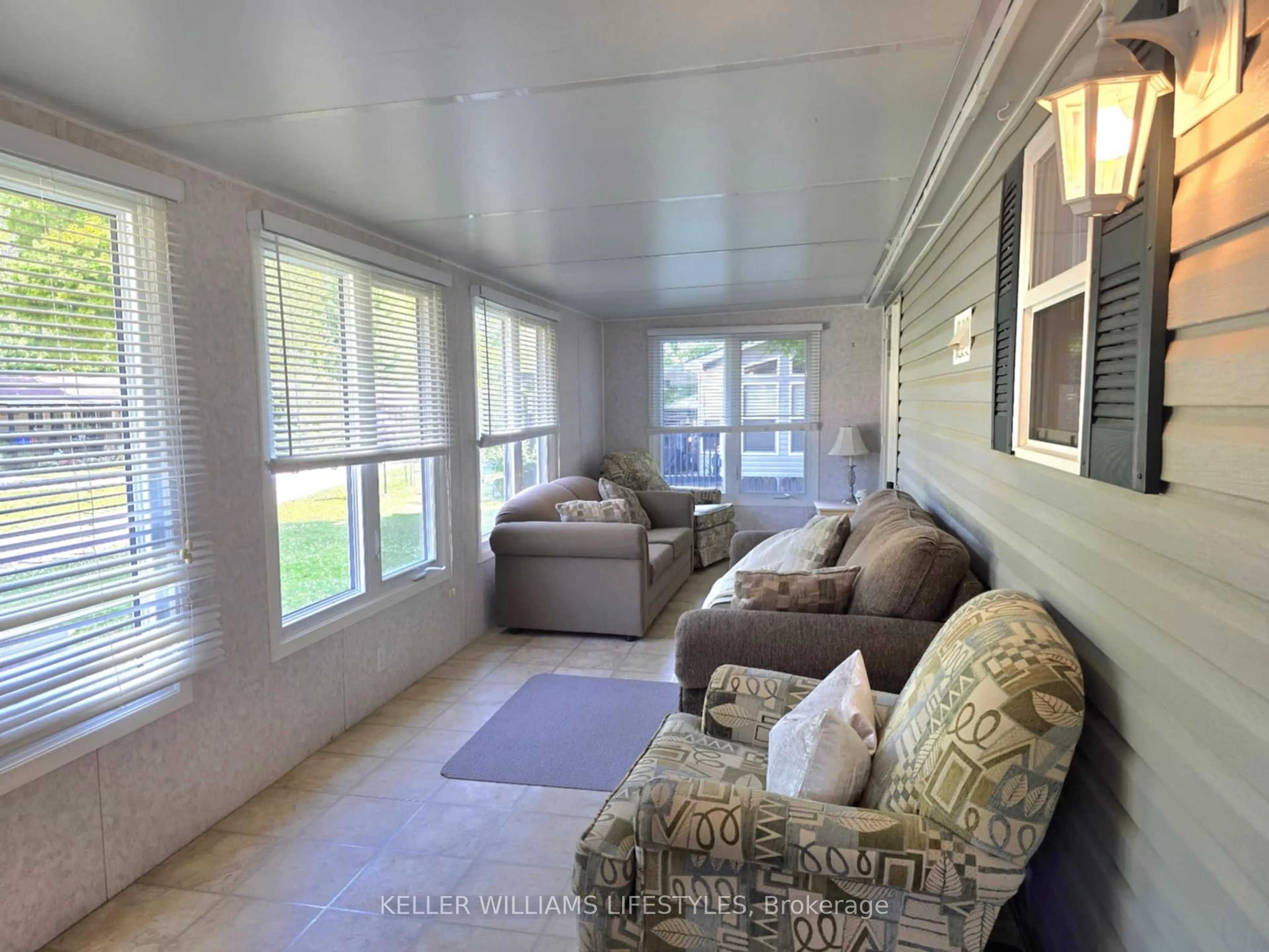 Living room with furniture, unknown for 9338 West Ipperwash Rd #JJ23, Lambton Shores Ontario N0N 1J2