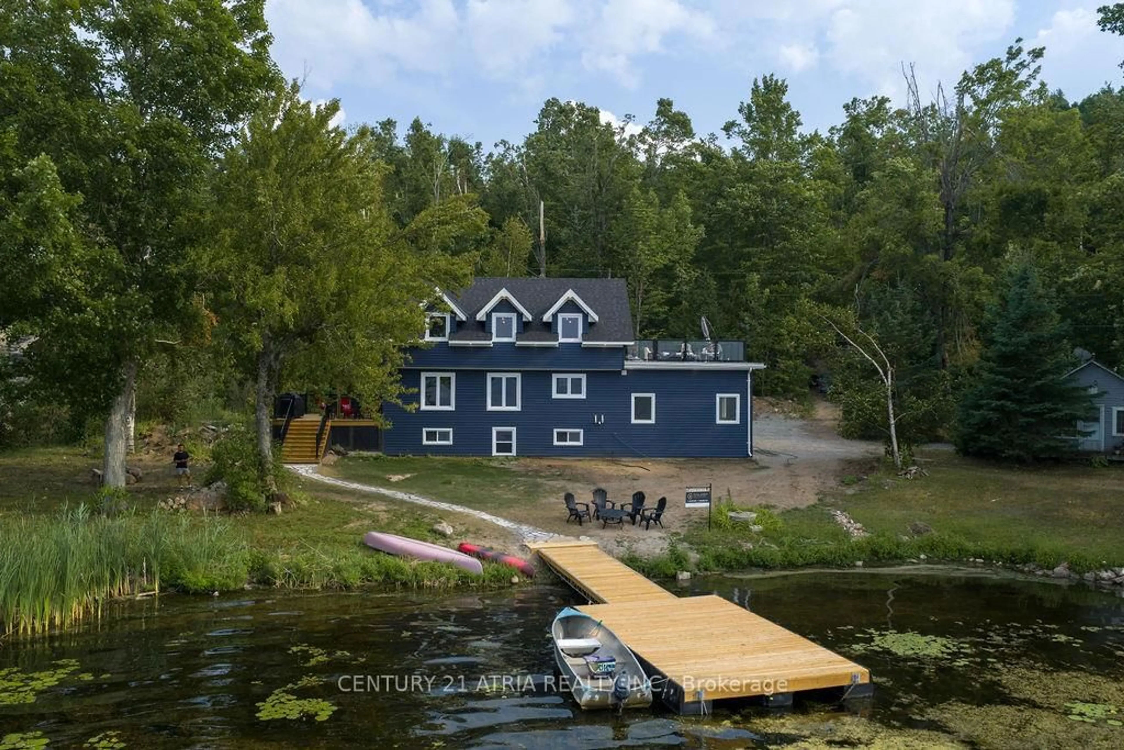 A pic from outside/outdoor area/front of a property/back of a property/a pic from drone, water/lake/river/ocean view for 2314 Armstrong Lane, Selwyn Ontario K0L 2H0