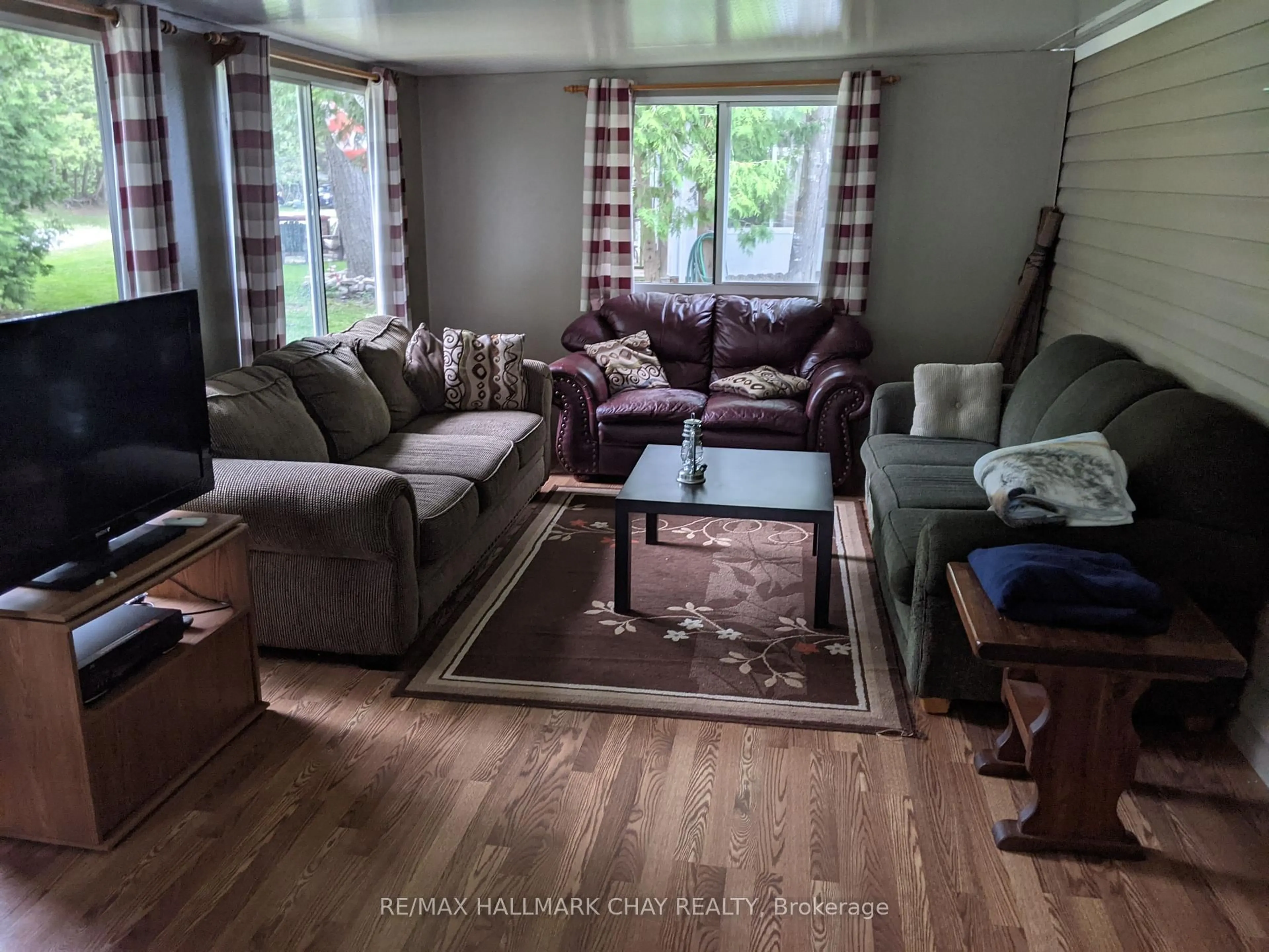 Living room with furniture, wood/laminate floor for 236 Nestle In Park Rd, Kawartha Lakes Ontario K0M 1C0