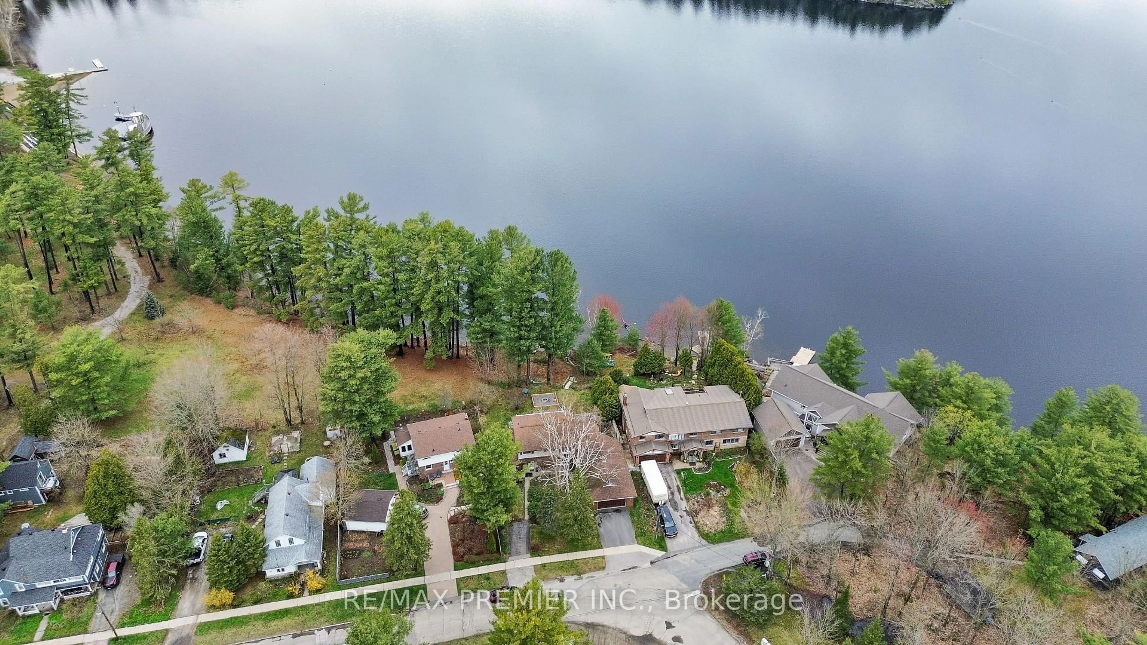 A pic from outside/outdoor area/front of a property/back of a property/a pic from drone, water/lake/river/ocean view for 570 Phillip St, Gravenhurst Ontario P1P 1M3