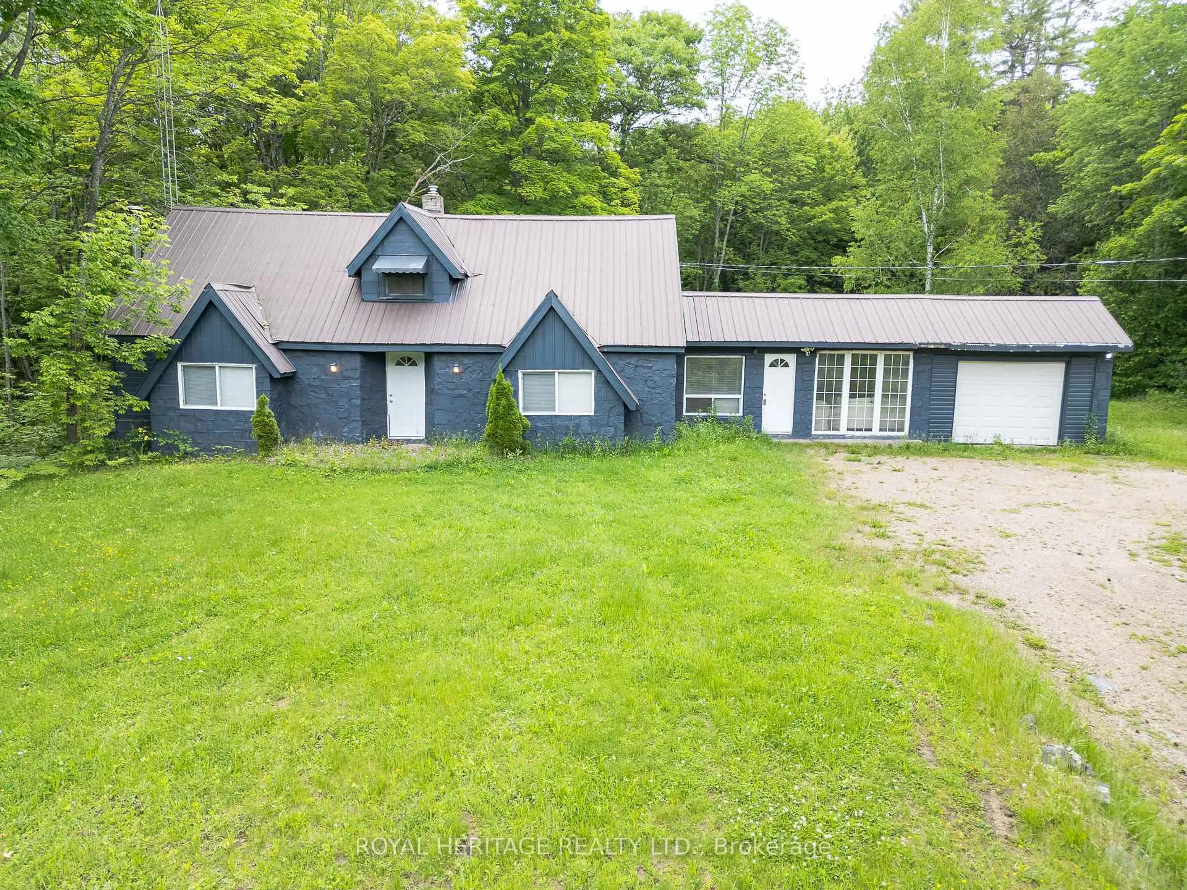 A pic from outside/outdoor area/front of a property/back of a property/a pic from drone, unknown for 17415 35 Highway, Algonquin Highlands Ontario K0M 2K0