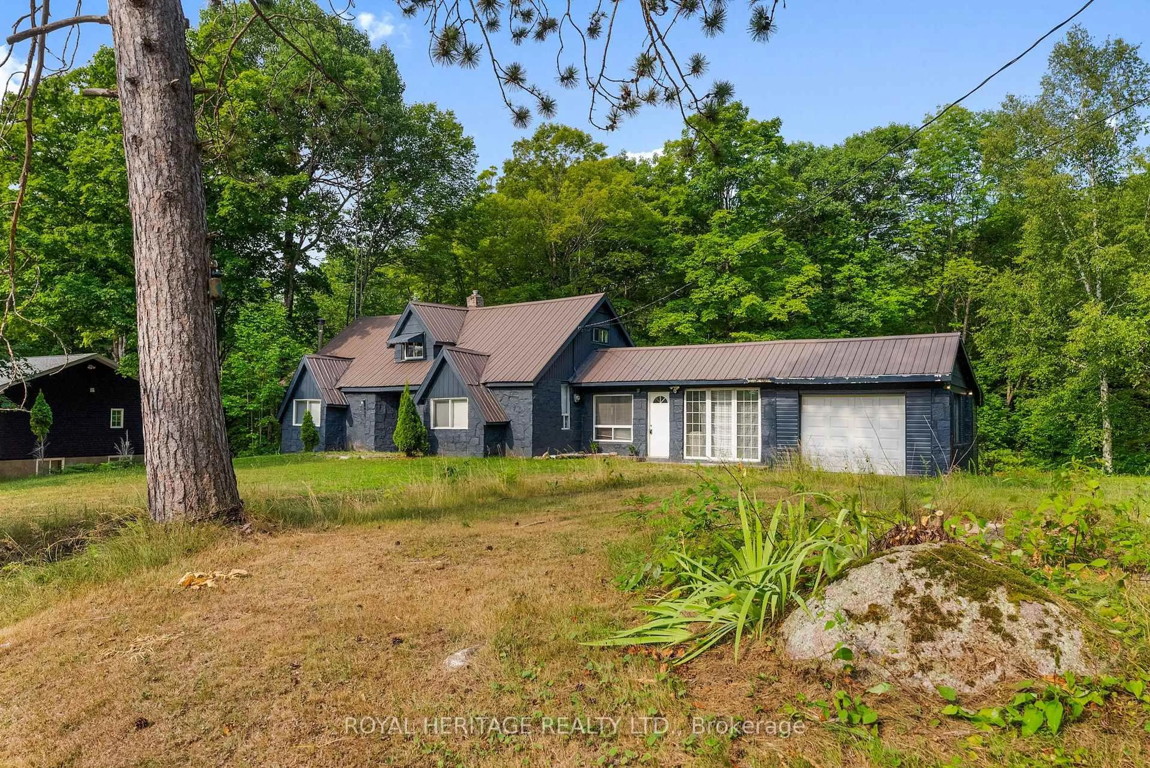 A pic from outside/outdoor area/front of a property/back of a property/a pic from drone, unknown for 17415 35 Highway, Algonquin Highlands Ontario K0M 2K0