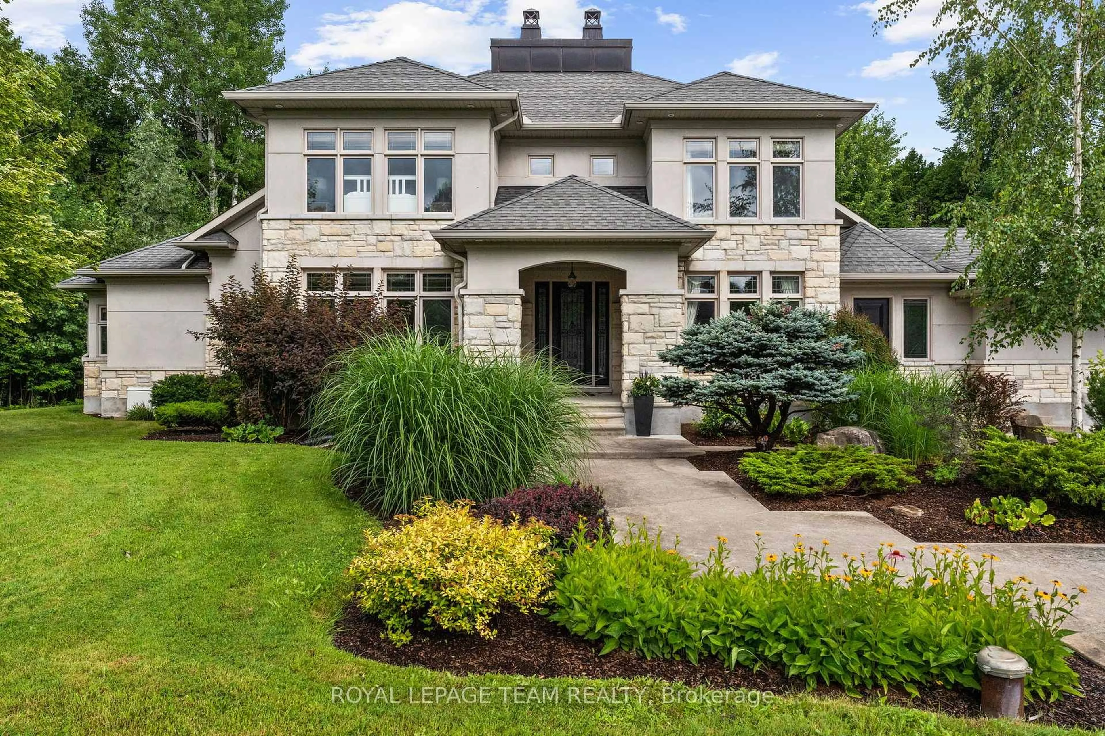 Home with brick exterior material, street for 5811 Longhearth Way, Ottawa Ontario K4M 1M2