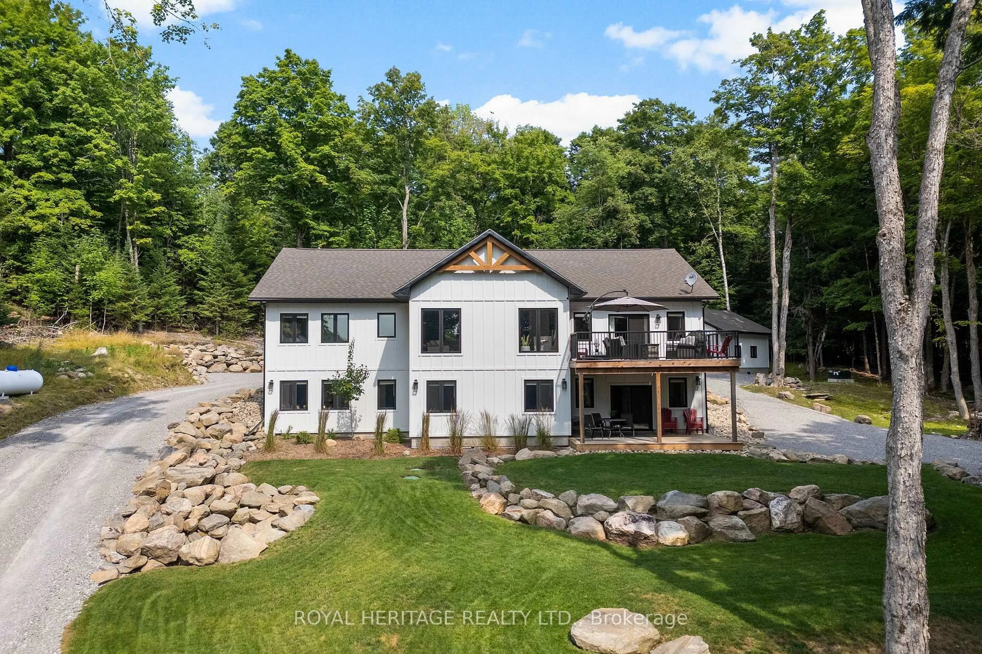 A pic from outside/outdoor area/front of a property/back of a property/a pic from drone, water/lake/river/ocean view for 51 Glebe Rd, Dysart et al Ontario K0M 1S0