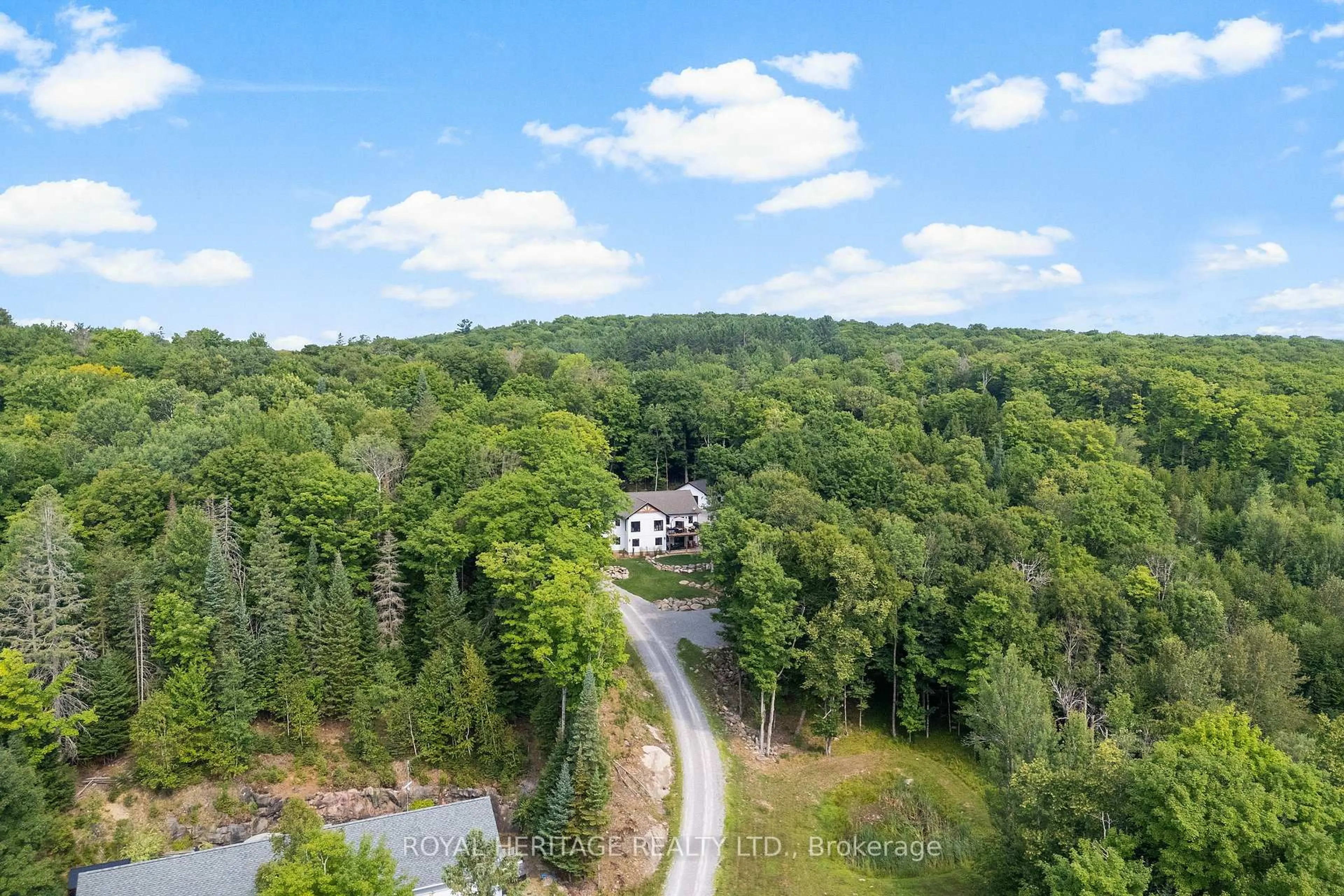 A pic from outside/outdoor area/front of a property/back of a property/a pic from drone, forest/trees view for 51 Glebe Rd, Dysart et al Ontario K0M 1S0