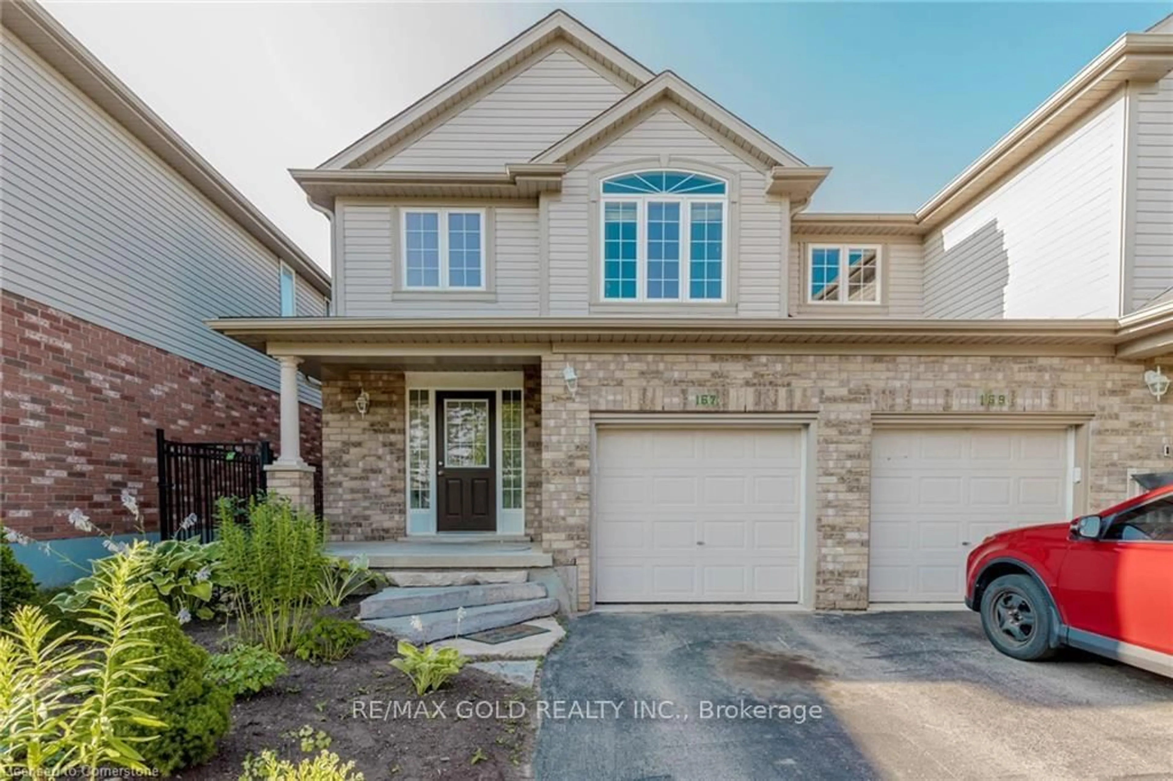 Home with brick exterior material, street for 167 Sims Estate Dr, Kitchener Ontario N2A 0A6