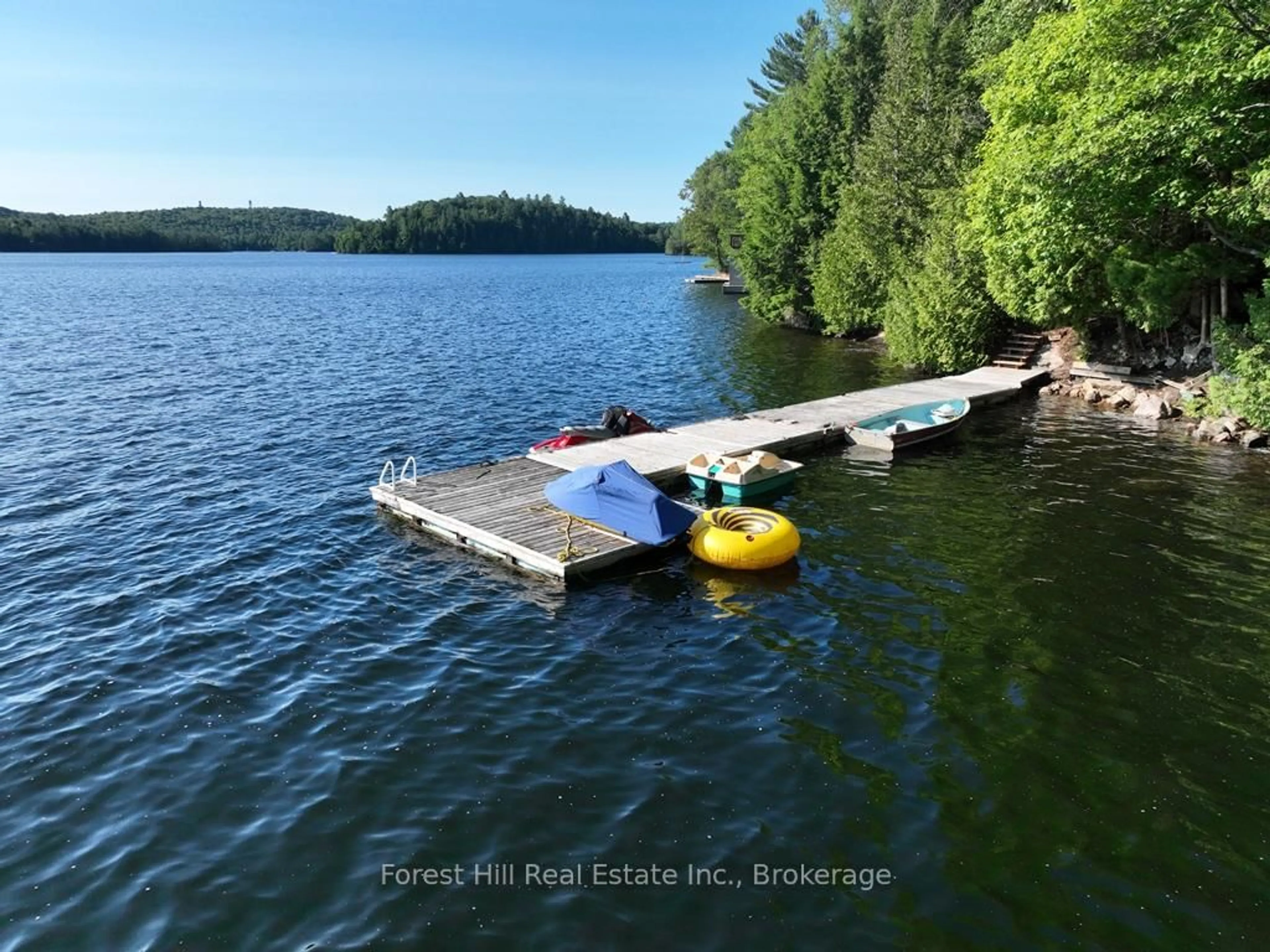 A pic from outside/outdoor area/front of a property/back of a property/a pic from drone, water/lake/river/ocean view for 10689 Kawagama Lake, Algonquin Highlands Ontario P0A 1E0