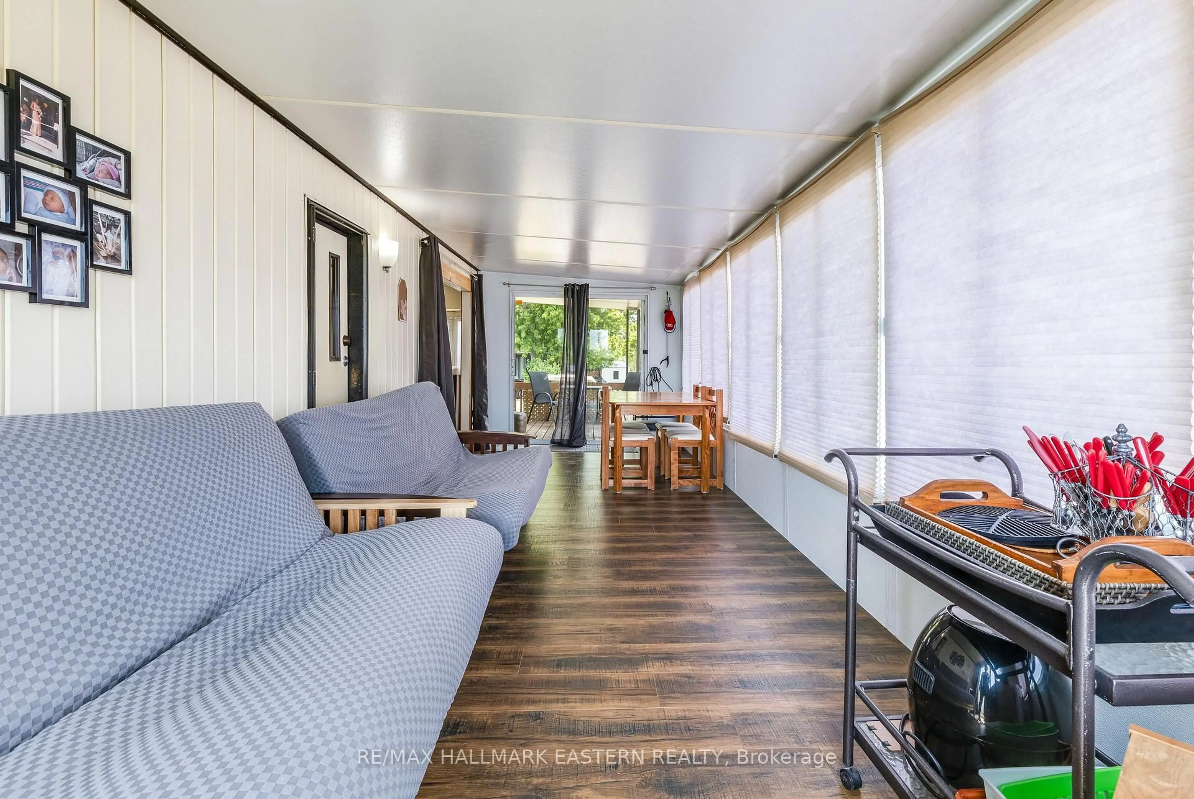 Living room with furniture, wood/laminate floor for 920 Skyline Rd ##1 Marina Cres, Selwyn Ontario K0L 1T0
