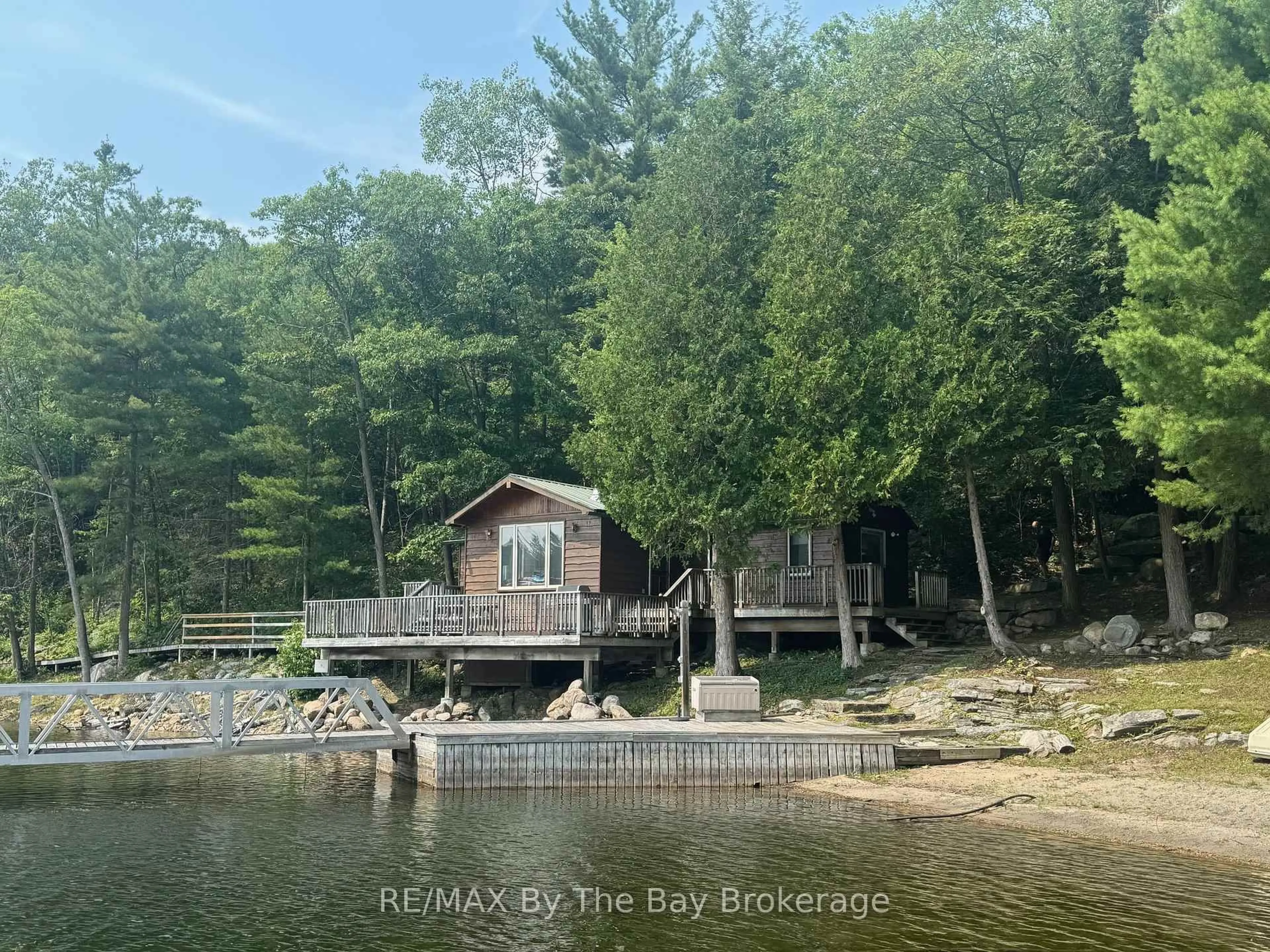 A pic from outside/outdoor area/front of a property/back of a property/a pic from drone, water/lake/river/ocean view for 1215 Harrison Tr, Georgian Bay Ontario P2A 0B7