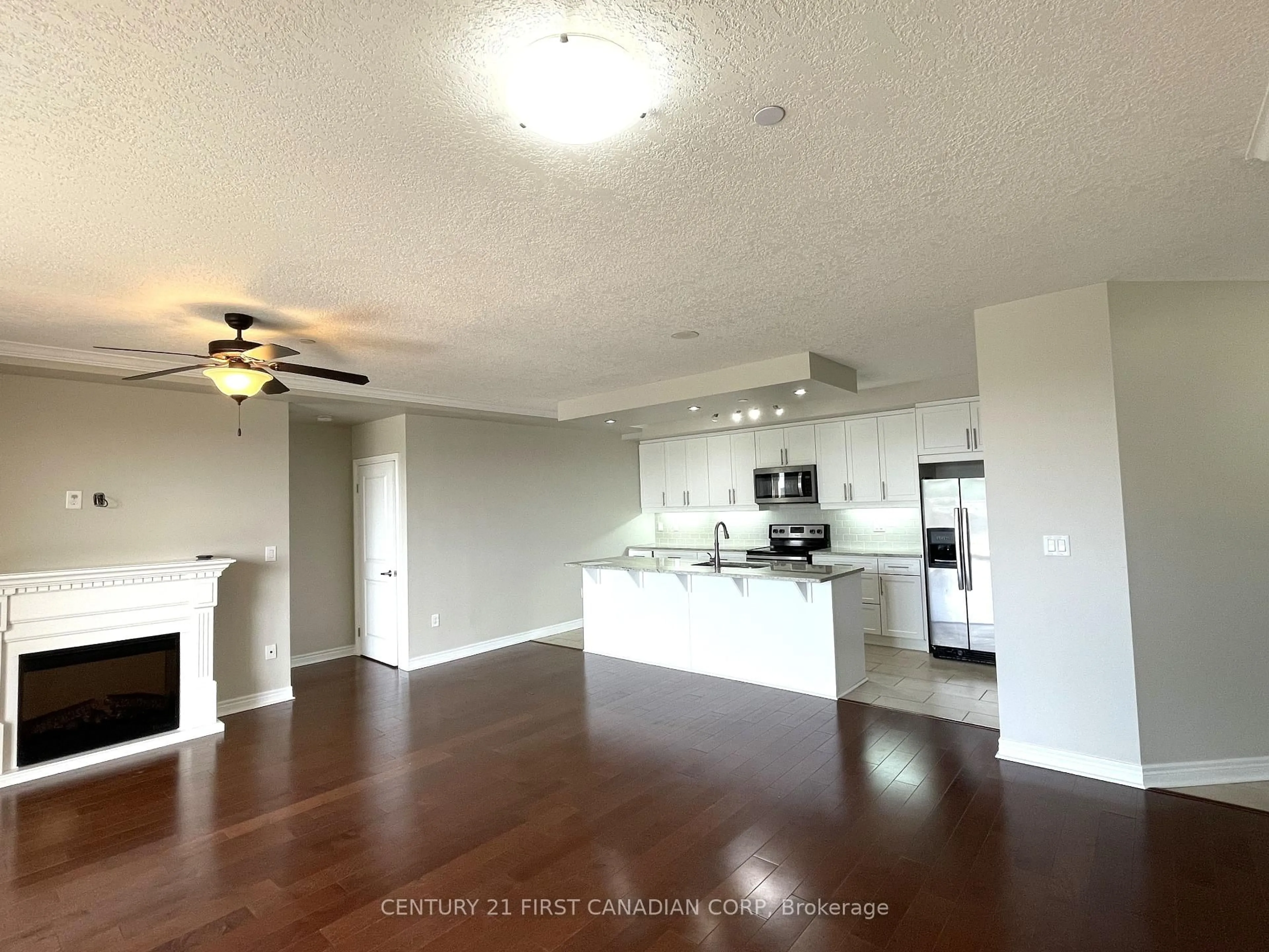 Open concept kitchen, wood/laminate floor for 330 RIDOUT St #1307, London East Ontario N6C 3Z3