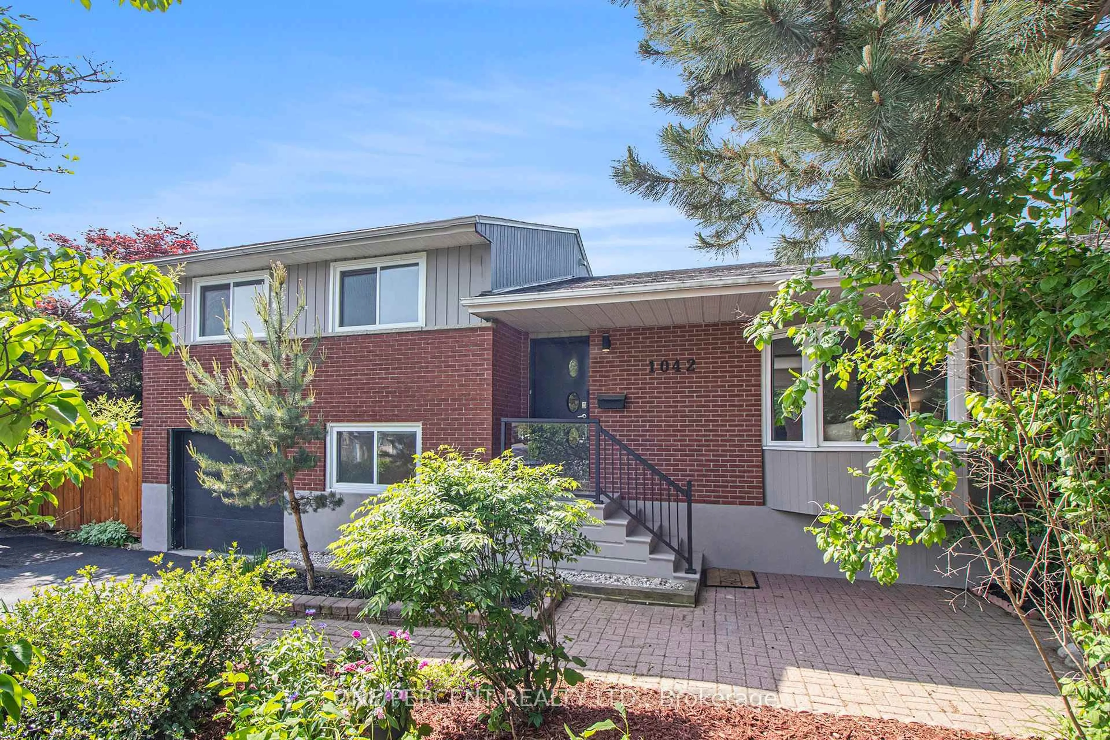Home with brick exterior material, street for 1042 Harkness Ave, Ottawa Ontario K1V 6P2